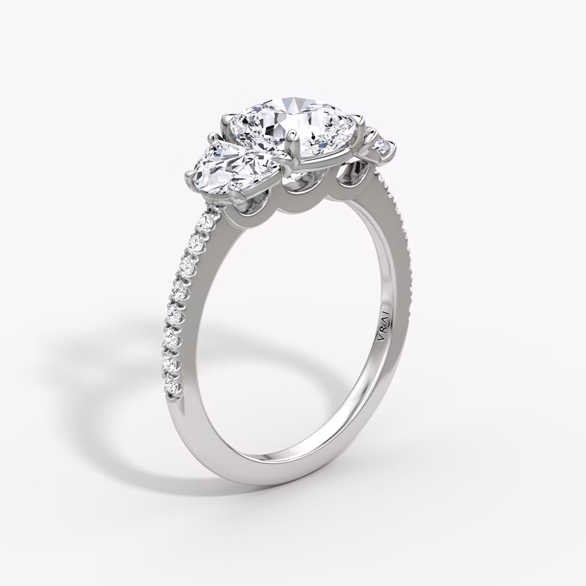 The Three Stone | Cushion | Platinum | bandAccent: Pavé | sideStoneCarat: 0.50ct | sideStoneShape: Half Moon | diamondOrientation: vertical | caratWeight: other