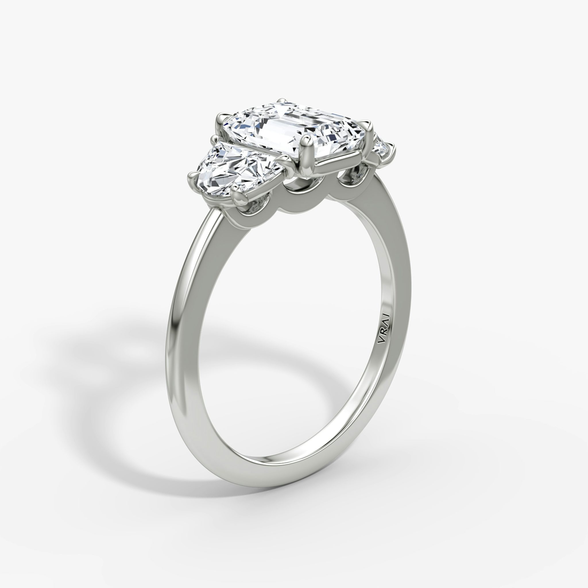 The Three Stone | Emerald | 18k | White Gold | bandAccent: Plain | sideStoneCarat: 0.50ct | sideStoneShape: Half Moon | diamondOrientation: vertical | caratWeight: other