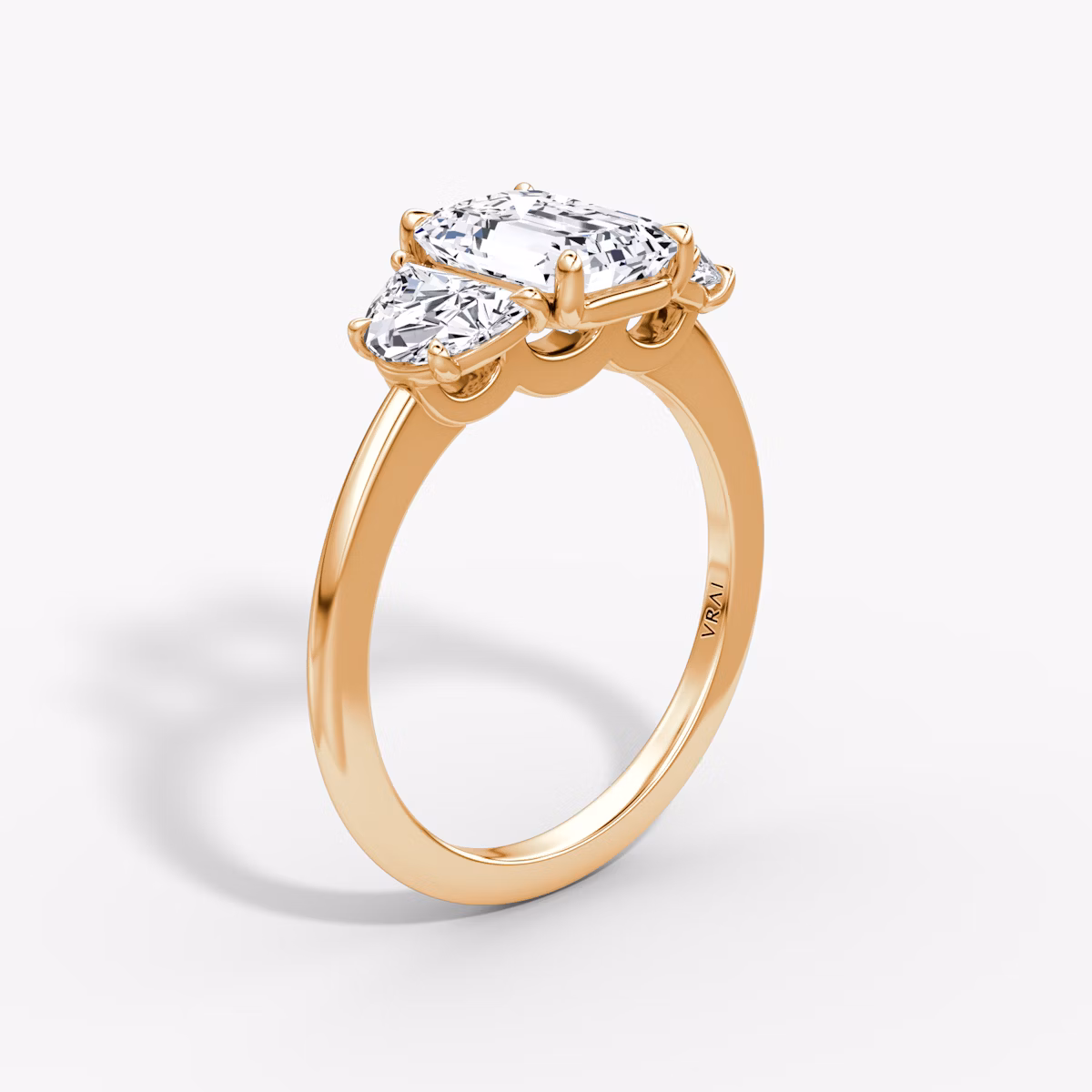 The Three Stone | Emerald | 14k | Rose Gold | bandAccent: Plain | sideStoneCarat: 0.50ct | sideStoneShape: Half Moon | diamondOrientation: vertical | caratWeight: other