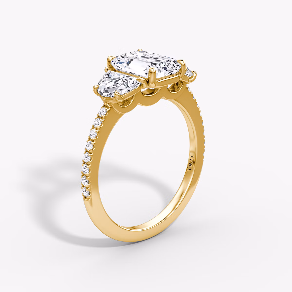 The Three Stone | Emerald | 18k | Yellow Gold | bandAccent: Pavé | sideStoneCarat: 0.50ct | sideStoneShape: Half Moon | diamondOrientation: vertical | caratWeight: other