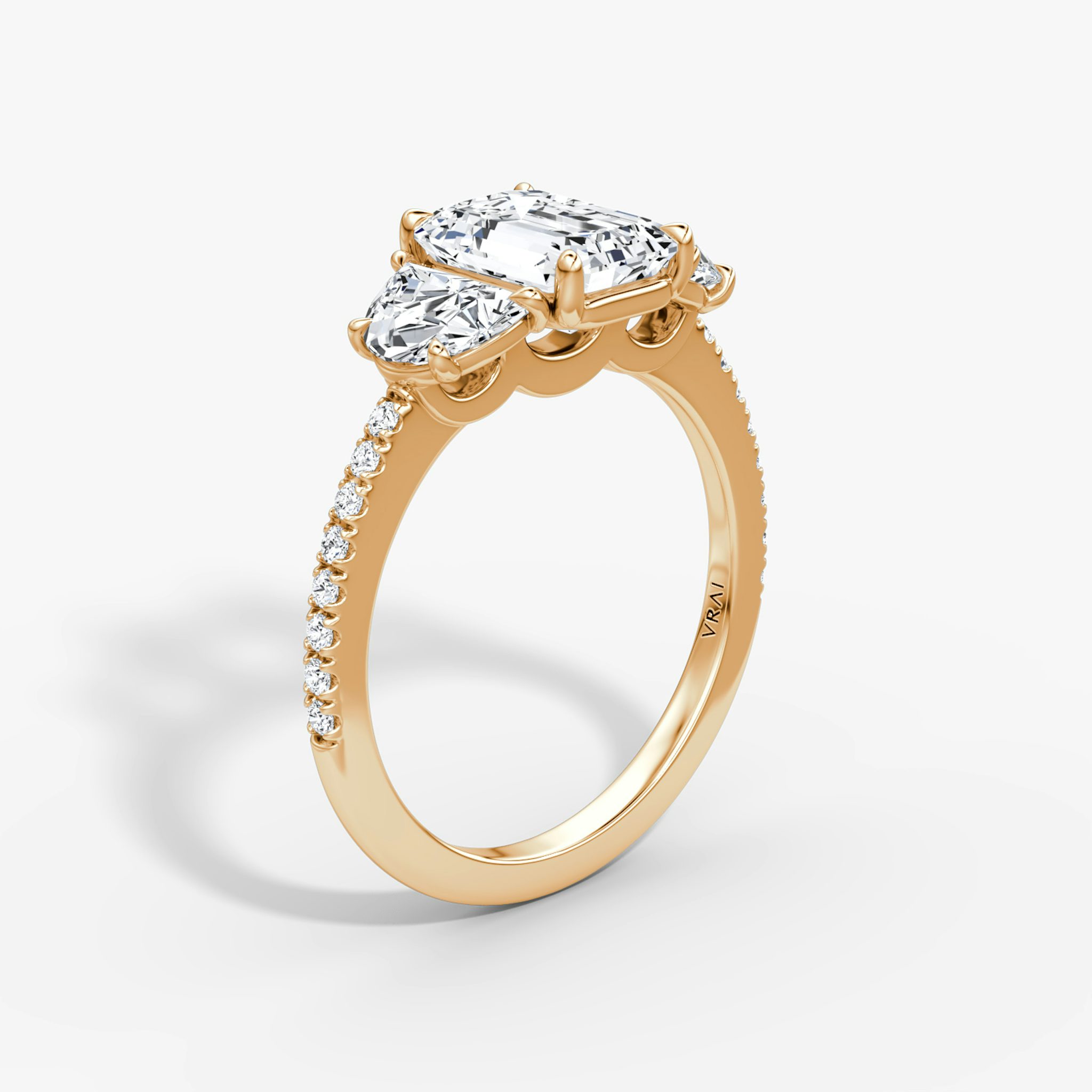 The Three Stone | Emerald | 14k | Rose Gold | bandAccent: Pavé | sideStoneCarat: 0.50ct | sideStoneShape: Half Moon | diamondOrientation: vertical | caratWeight: other