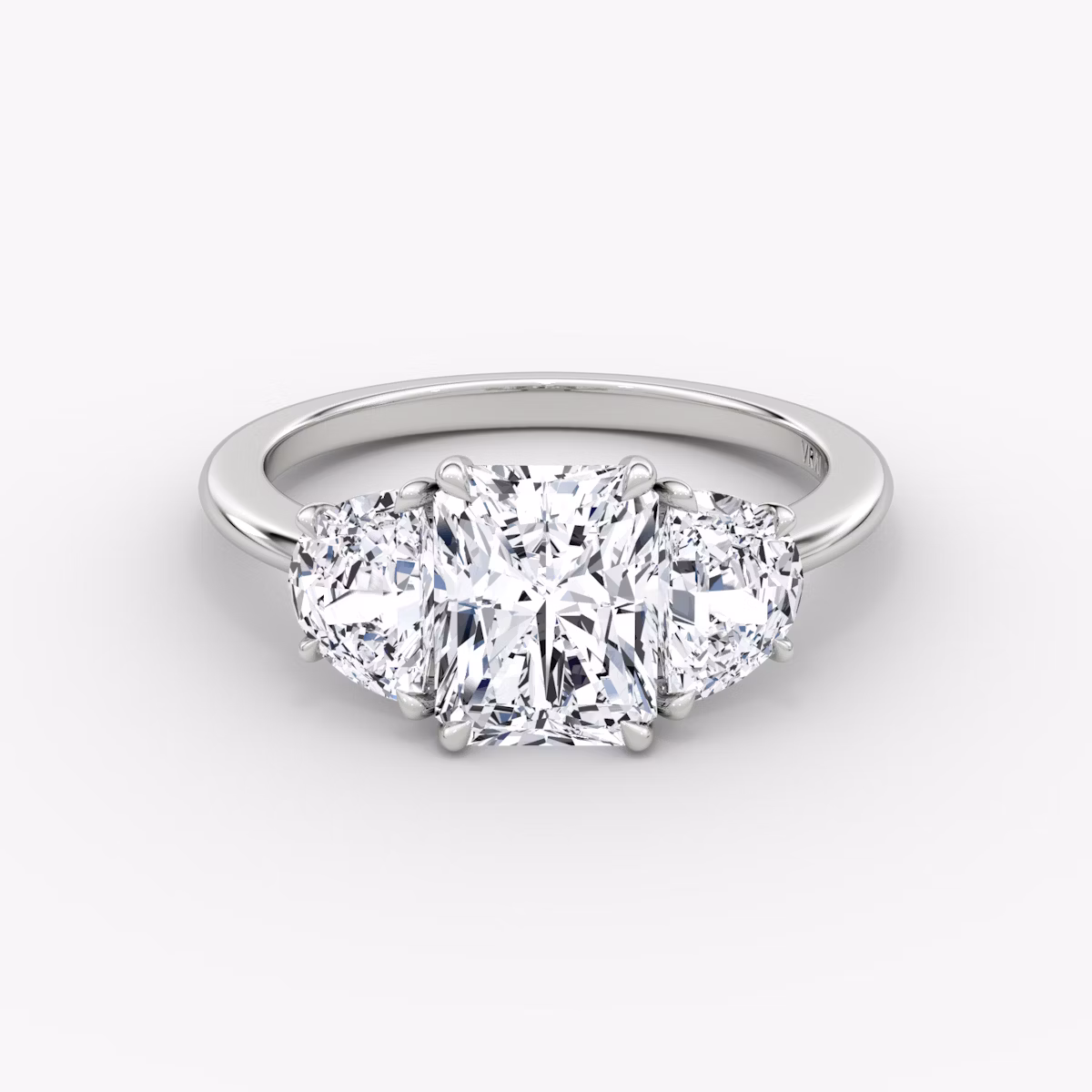 The Three Stone | Radiant | Platinum | bandAccent: Plain | sideStoneCarat: 0.50ct | sideStoneShape: Half Moon | diamondOrientation: vertical | caratWeight: other