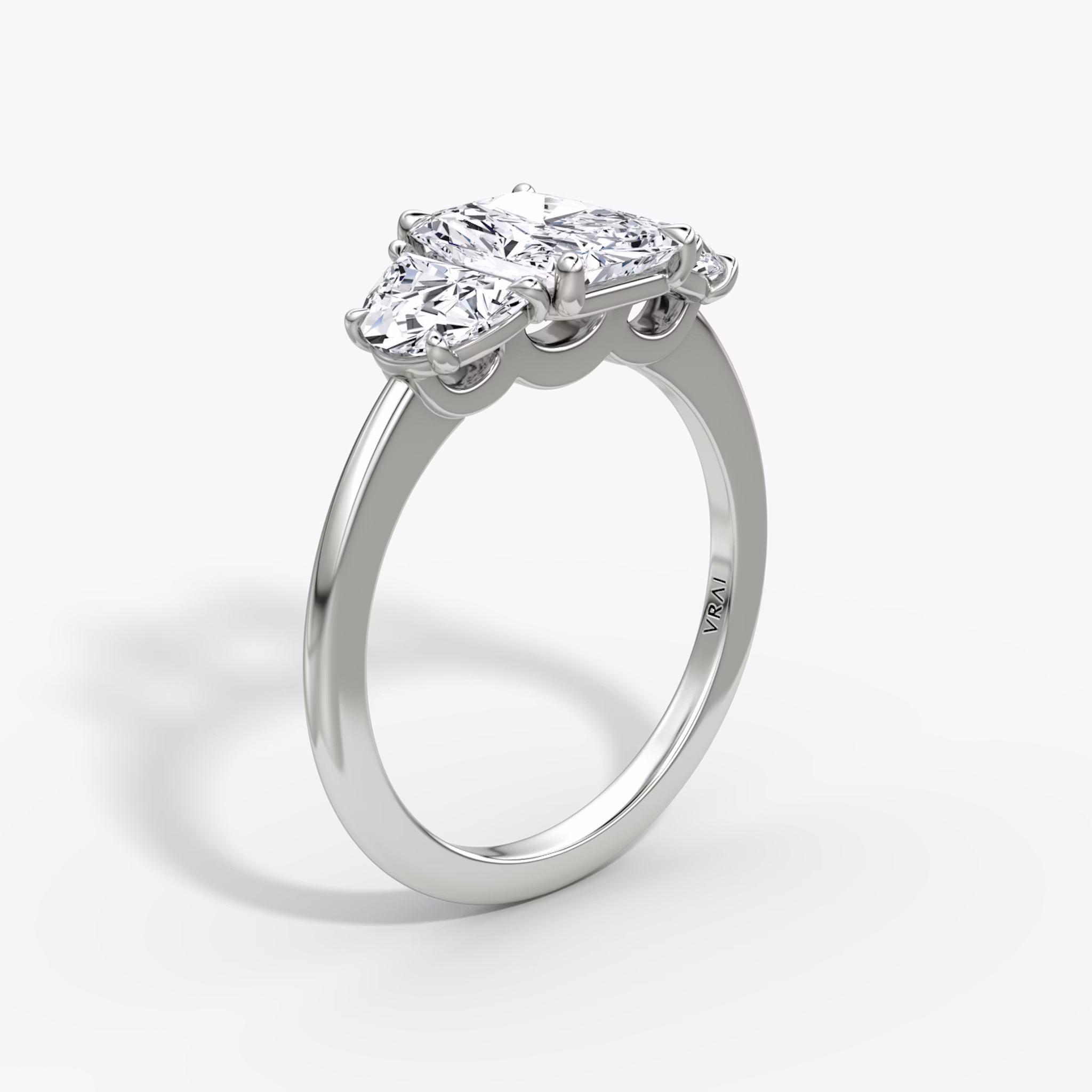 The Three Stone | Radiant | 18k | White Gold | bandAccent: Plain | sideStoneCarat: 0.50ct | sideStoneShape: Half Moon | diamondOrientation: vertical | caratWeight: other