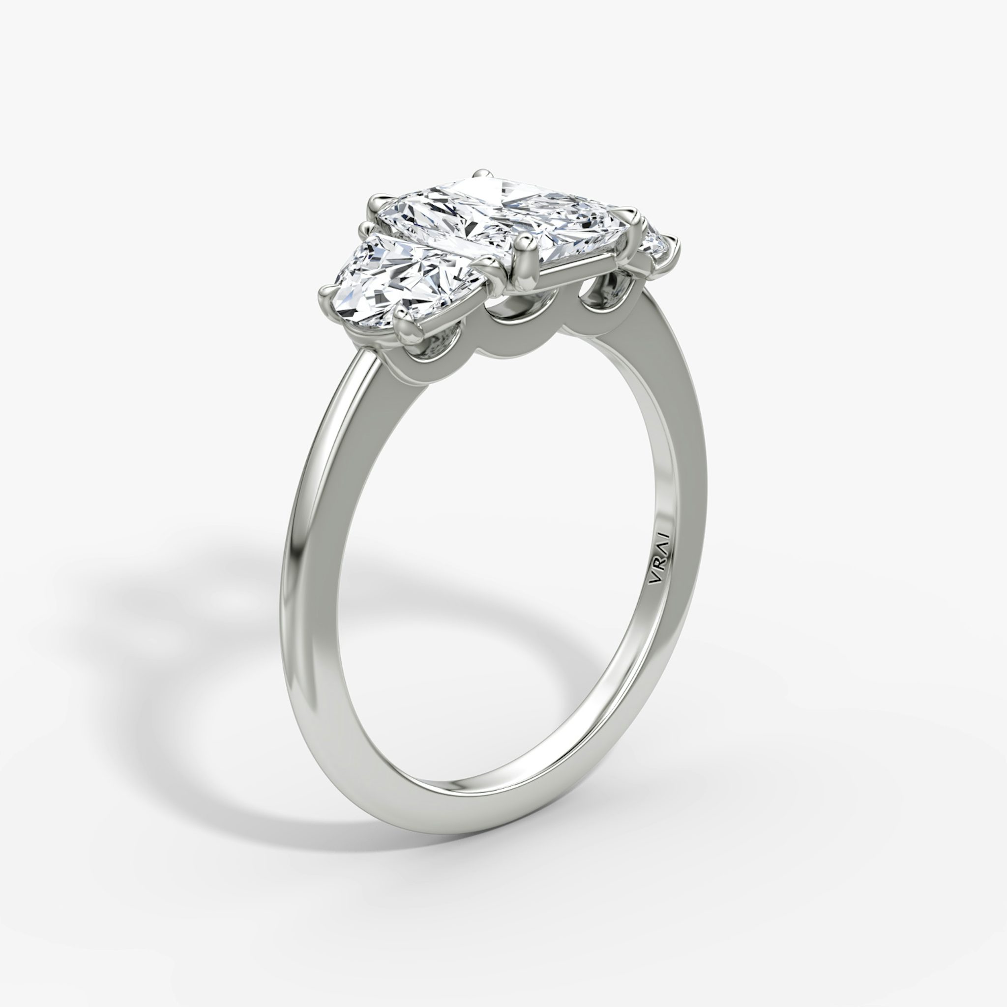 The Three Stone | Radiant | 18k | White Gold | bandAccent: Plain | sideStoneCarat: 0.50ct | sideStoneShape: Half Moon | diamondOrientation: vertical | caratWeight: other