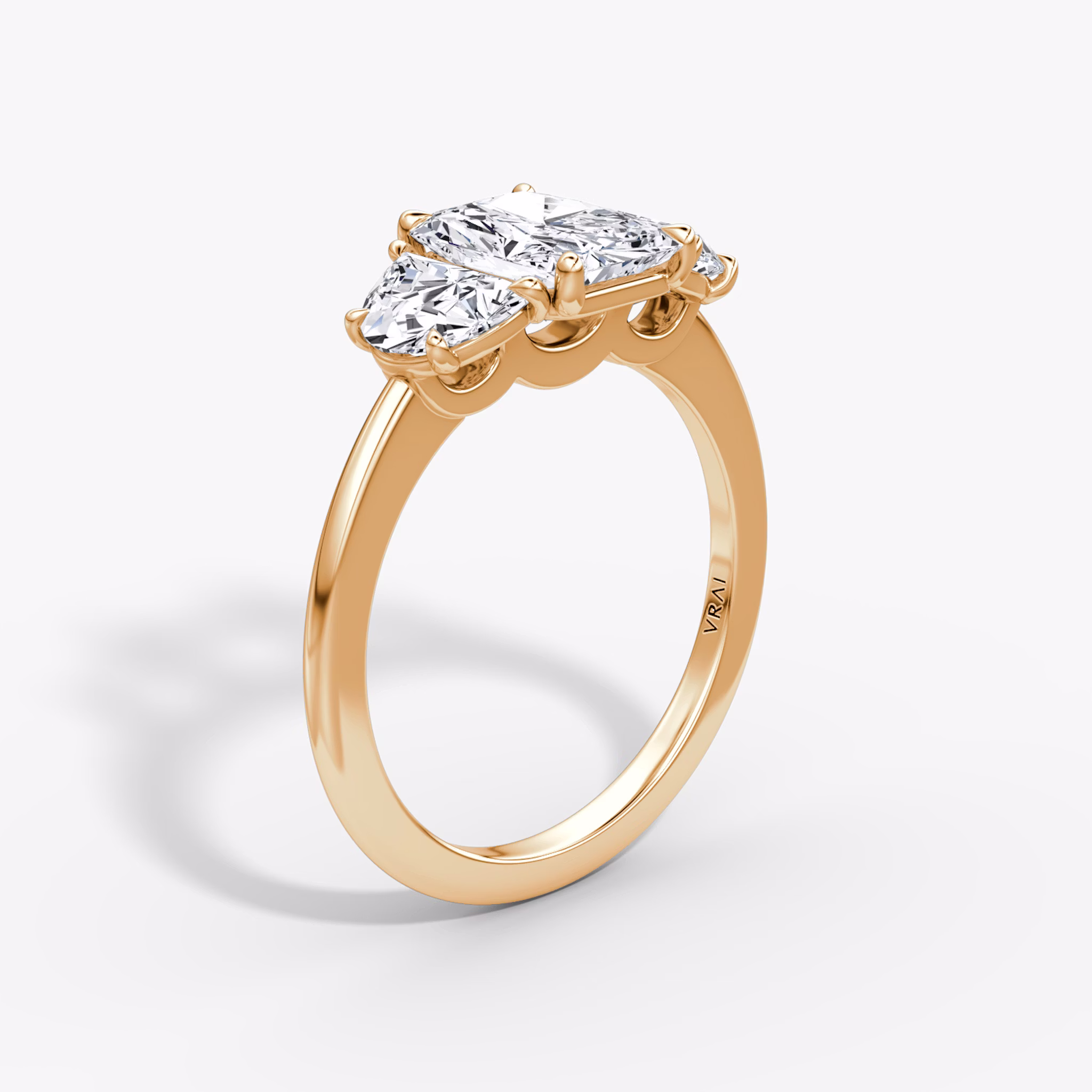 The Three Stone | Radiant | 14k | Rose Gold | bandAccent: Plain | sideStoneCarat: 0.50ct | sideStoneShape: Half Moon | diamondOrientation: vertical | caratWeight: other