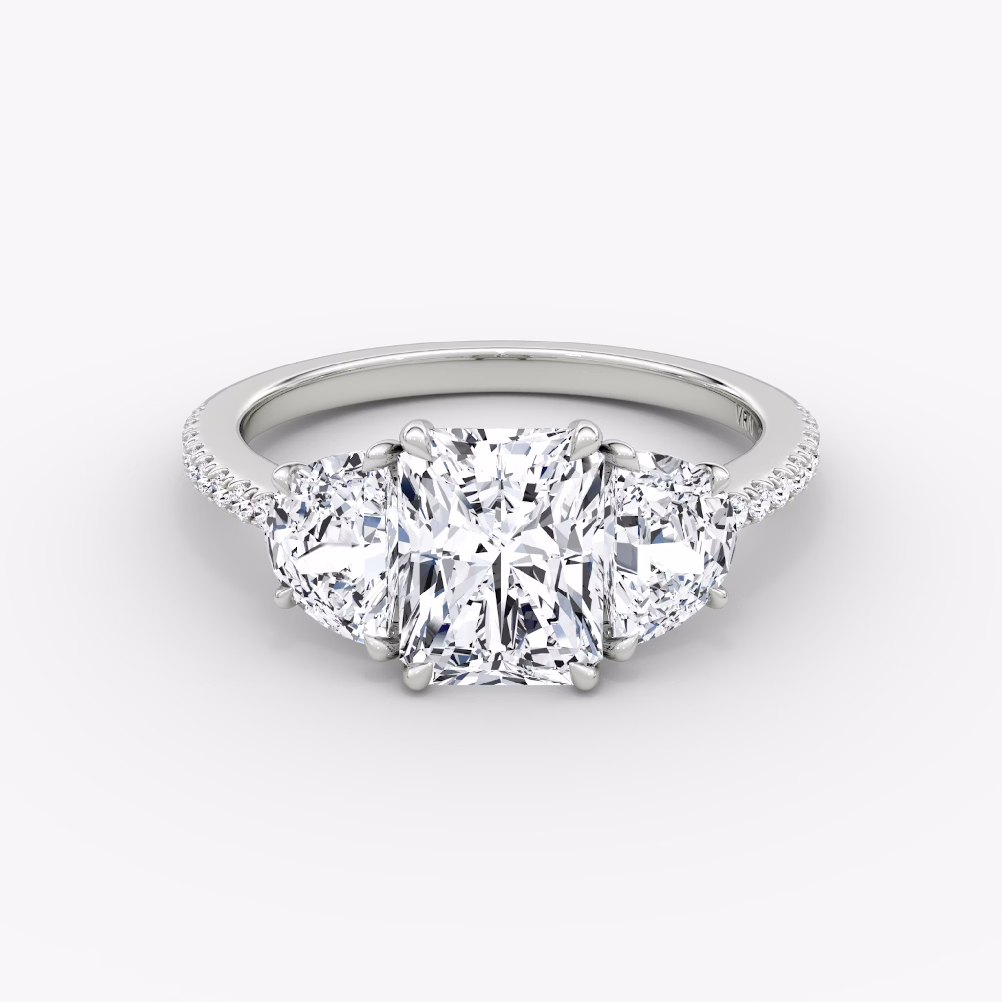 The Three Stone | Radiant | 18k | White Gold | bandAccent: Pavé | sideStoneCarat: 0.50ct | sideStoneShape: Half Moon | diamondOrientation: vertical | caratWeight: other