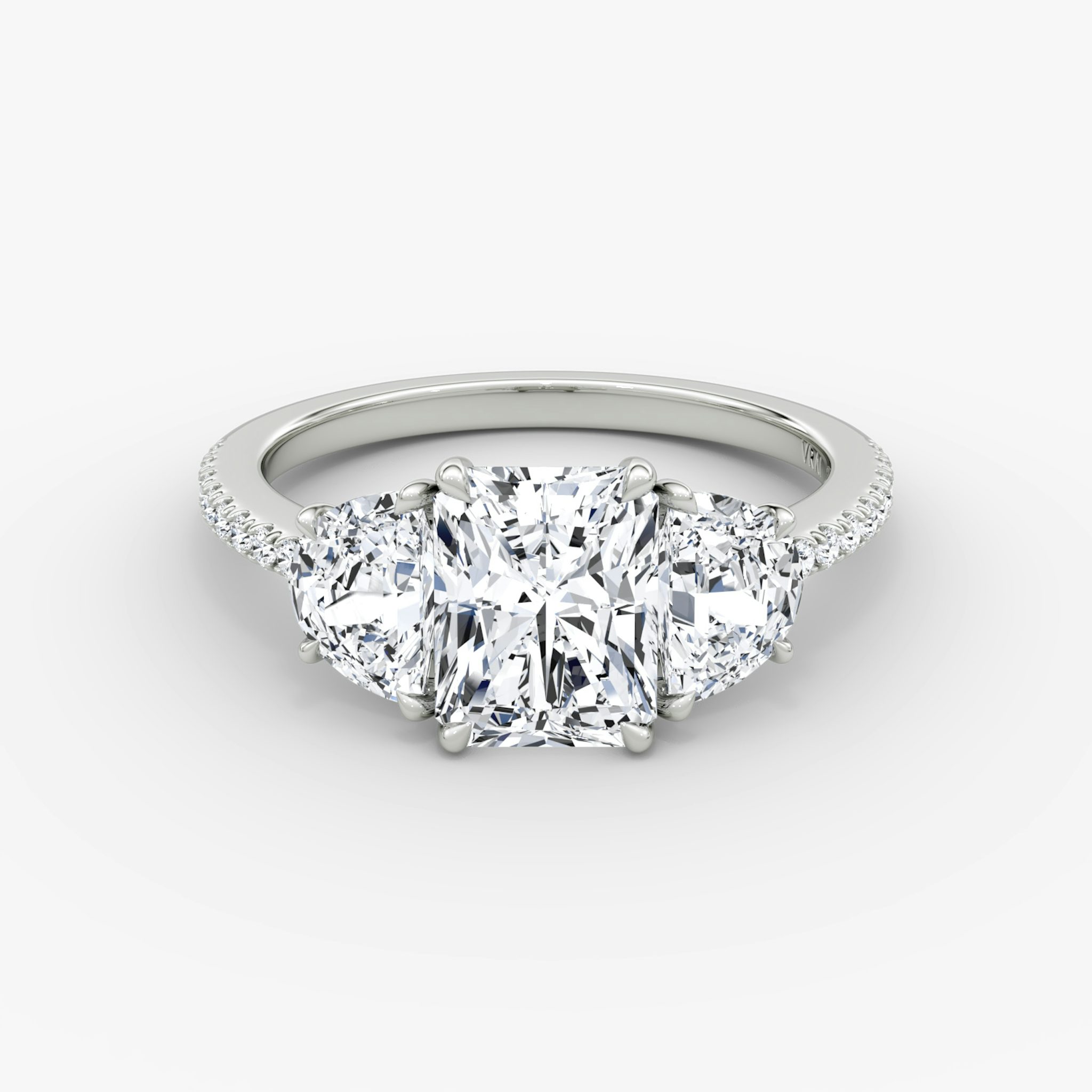 The Three Stone | Radiant | 18k | White Gold | bandAccent: Pavé | sideStoneCarat: 0.50ct | sideStoneShape: Half Moon | diamondOrientation: vertical | caratWeight: other