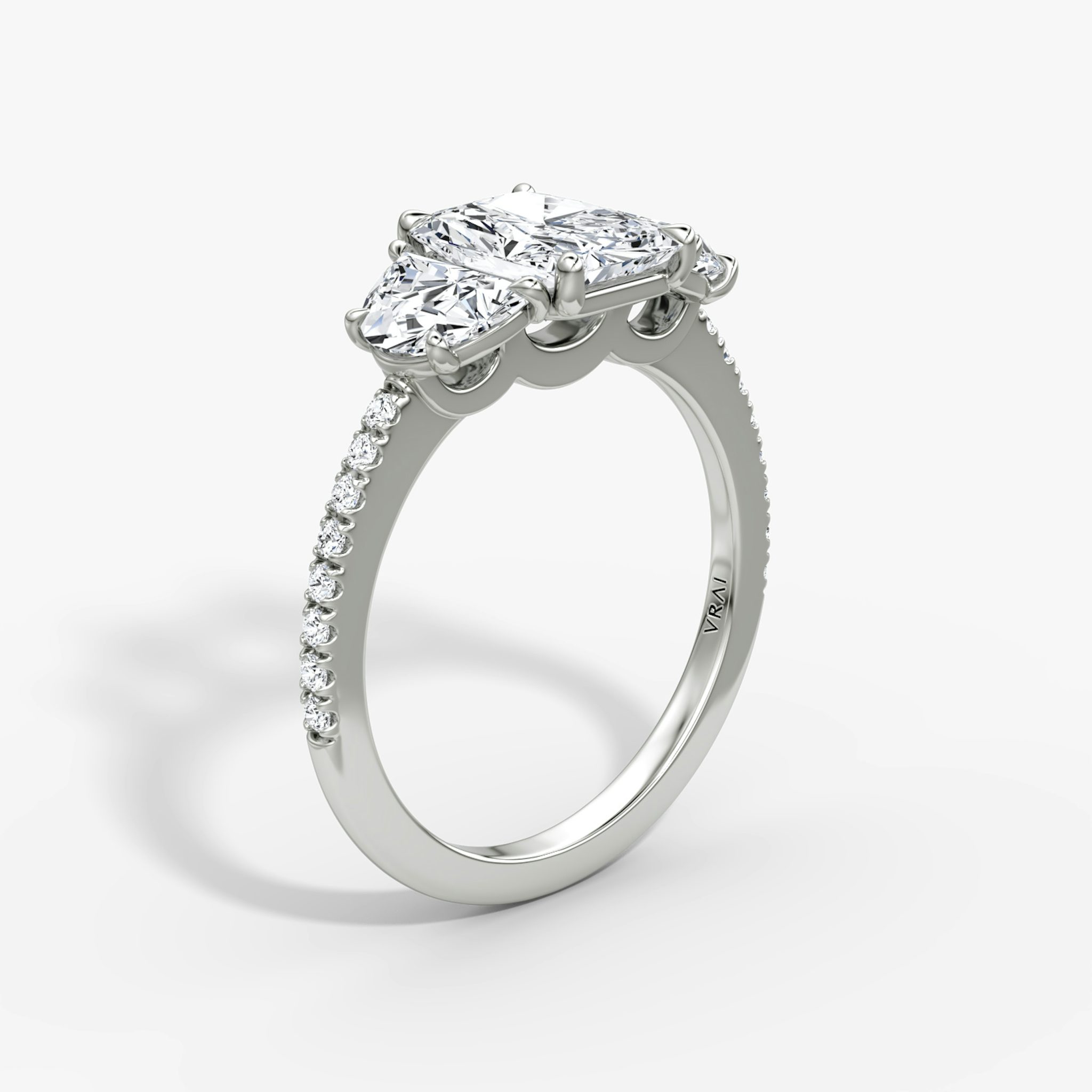 The Three Stone | Radiant | 18k | White Gold | bandAccent: Pavé | sideStoneCarat: 0.50ct | sideStoneShape: Half Moon | diamondOrientation: vertical | caratWeight: other