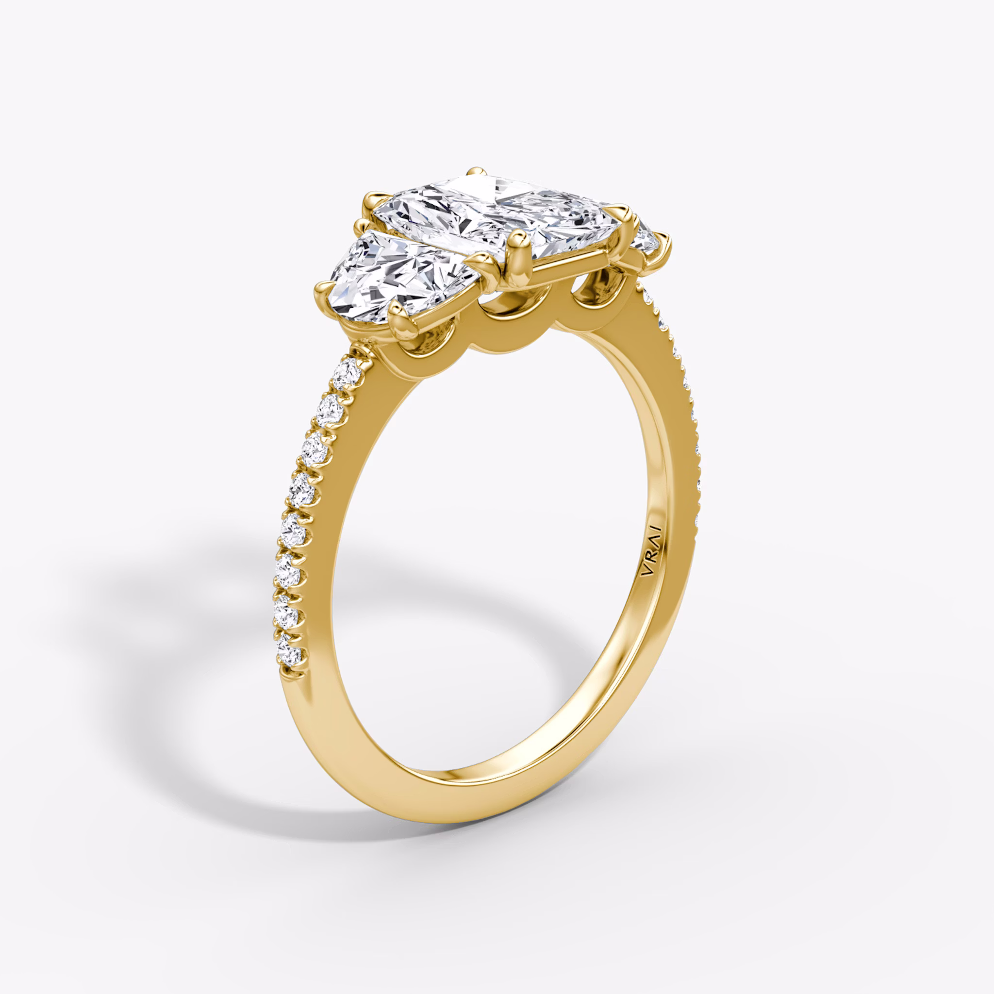 The Three Stone | Radiant | 18k | Yellow Gold | bandAccent: Pavé | sideStoneCarat: 0.50ct | sideStoneShape: Half Moon | diamondOrientation: vertical | caratWeight: other