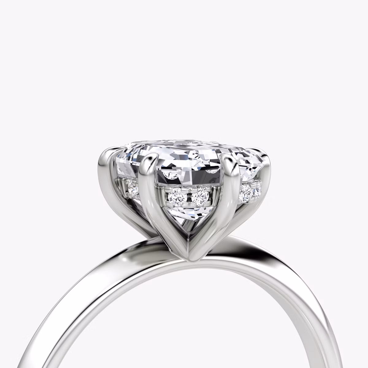 The Knife-Edge | Emerald | Platinum | bandAccent: Plain | hiddenHalo: yes | diamondOrientation: vertical | caratWeight: other