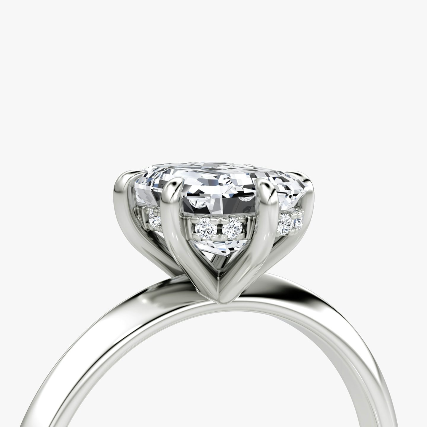 The Knife-Edge | Emerald | Platinum | bandAccent: Plain | hiddenHalo: yes | diamondOrientation: vertical | caratWeight: other