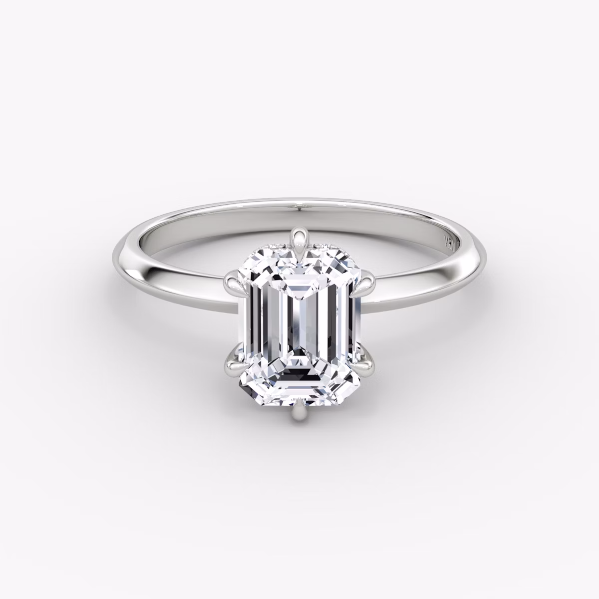 The Knife-Edge | Emerald | Platinum | bandAccent: Plain | hiddenHalo: yes | diamondOrientation: vertical | caratWeight: other