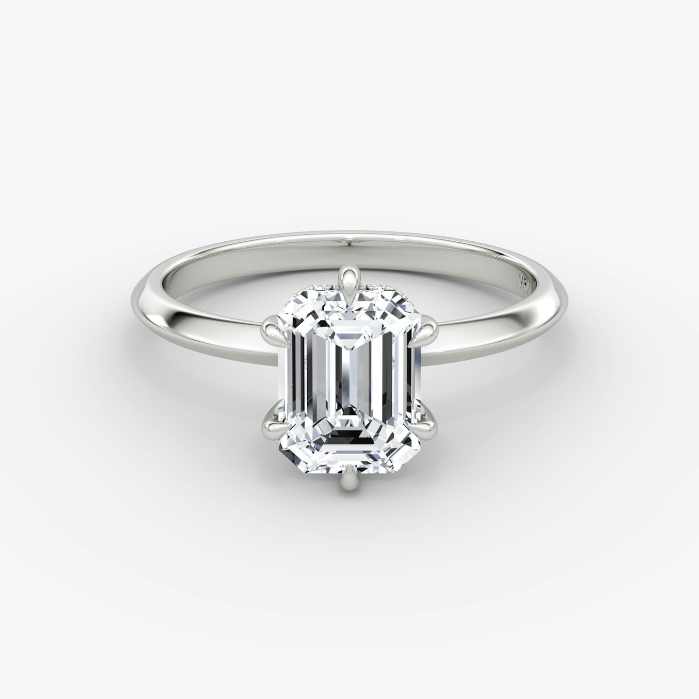 The Knife-Edge | Emerald | Platinum | bandAccent: Plain | hiddenHalo: yes | diamondOrientation: vertical | caratWeight: other