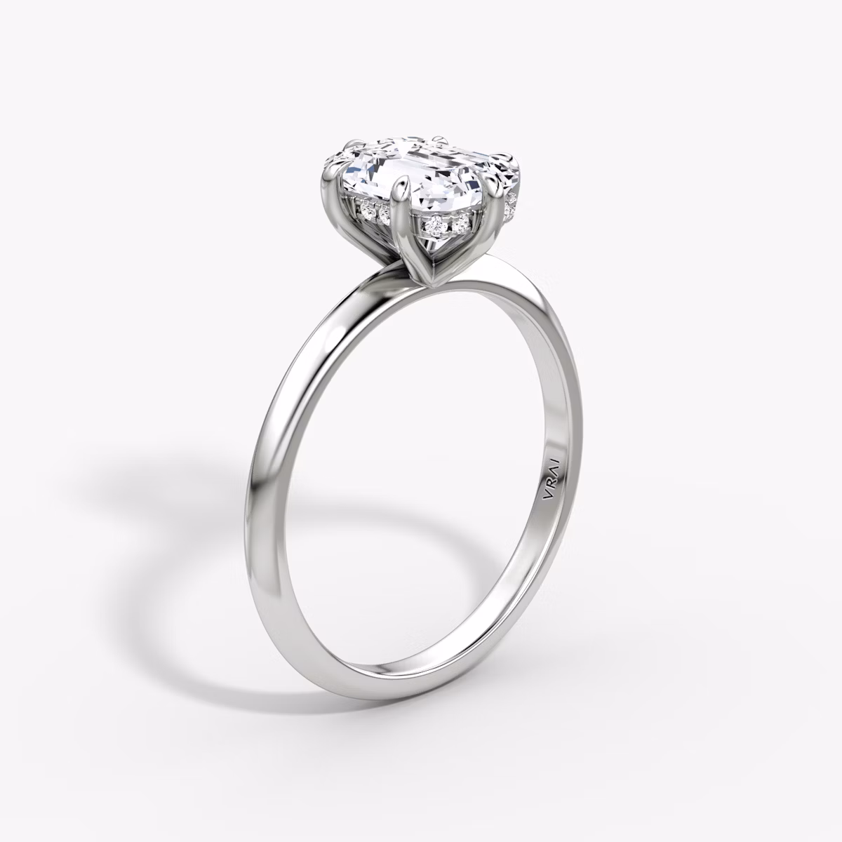 The Knife-Edge | Emerald | Platinum | bandAccent: Plain | hiddenHalo: yes | diamondOrientation: vertical | caratWeight: other