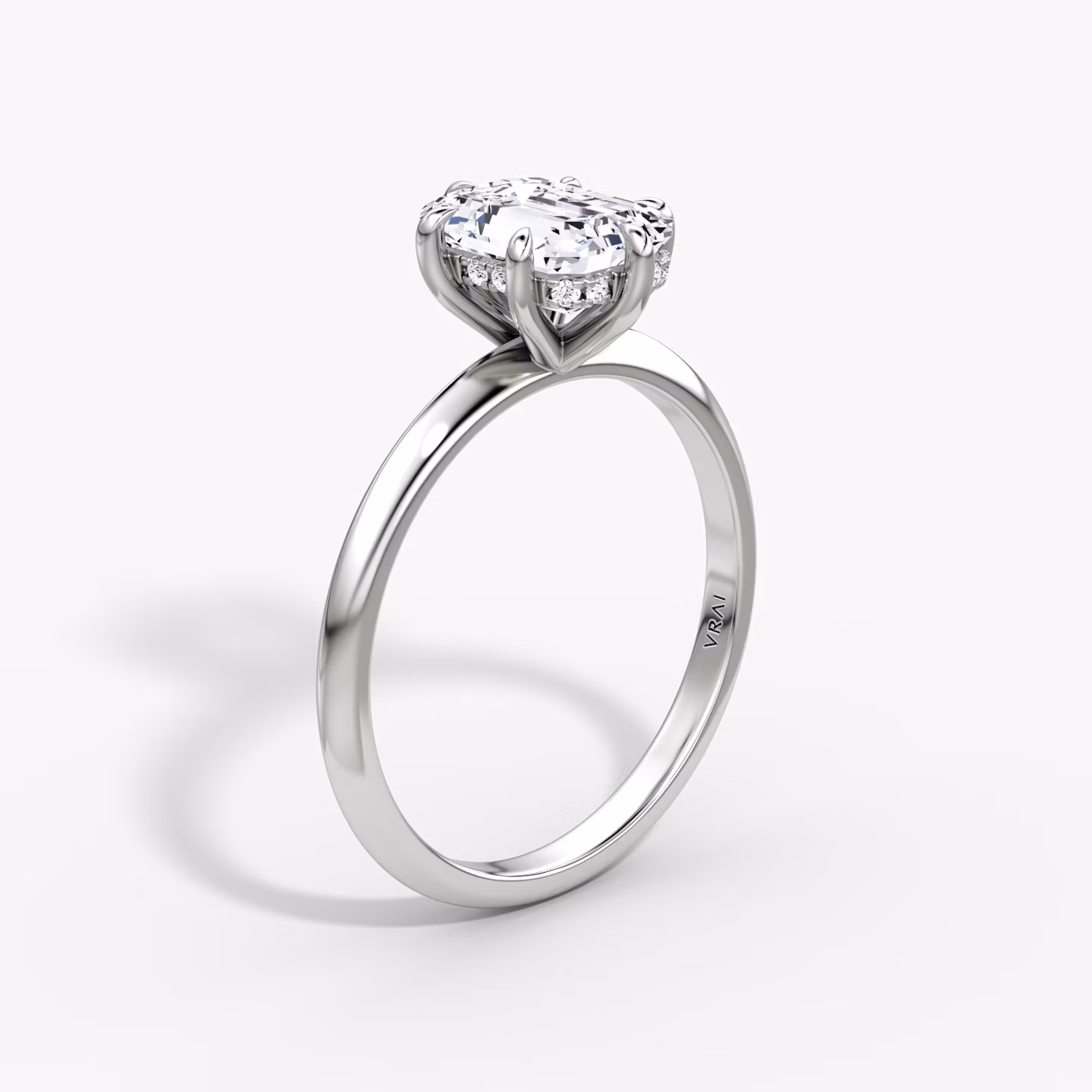 The Knife-Edge | Emerald | Platinum | bandAccent: Plain | hiddenHalo: yes | diamondOrientation: vertical | caratWeight: other