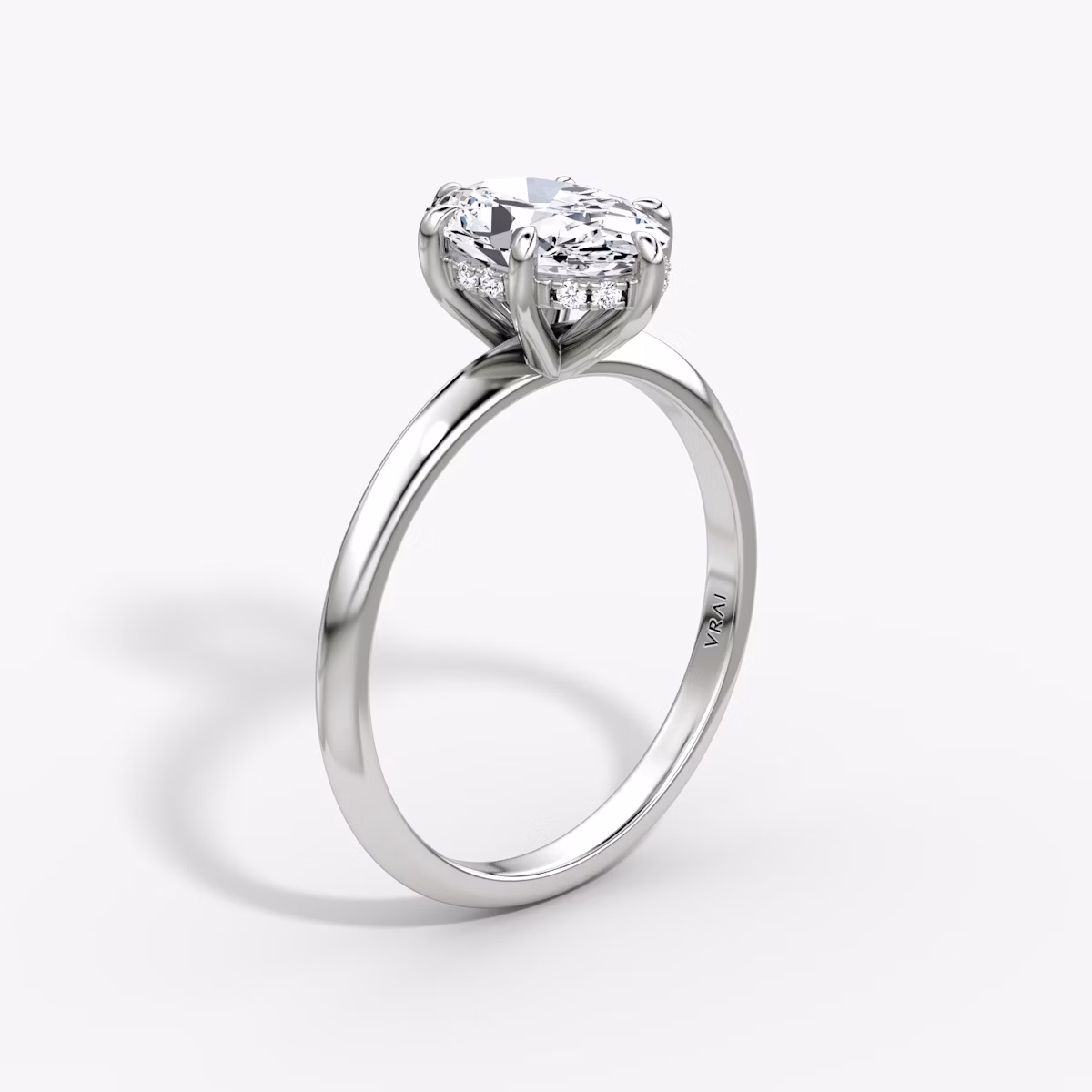 The Knife-Edge | Oval | Platinum | bandAccent: Plain | hiddenHalo: yes | diamondOrientation: vertical | caratWeight: other