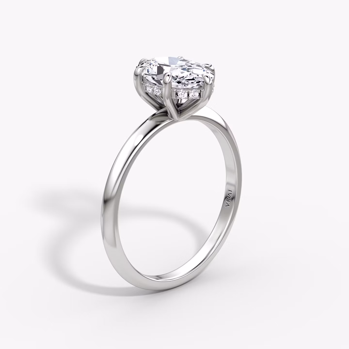 The Knife-Edge | Oval | 18k | White Gold | bandAccent: Plain | hiddenHalo: yes | diamondOrientation: vertical | caratWeight: other
