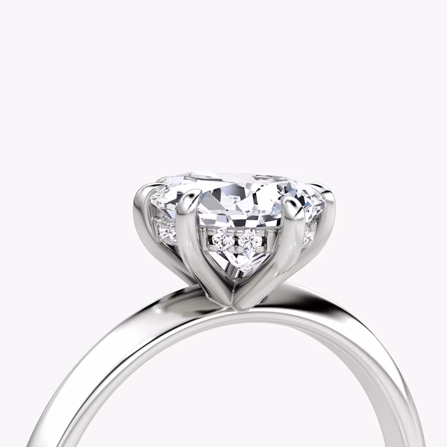 The Knife-Edge | Pear | Platinum | bandAccent: Plain | hiddenHalo: yes | diamondOrientation: vertical | caratWeight: other