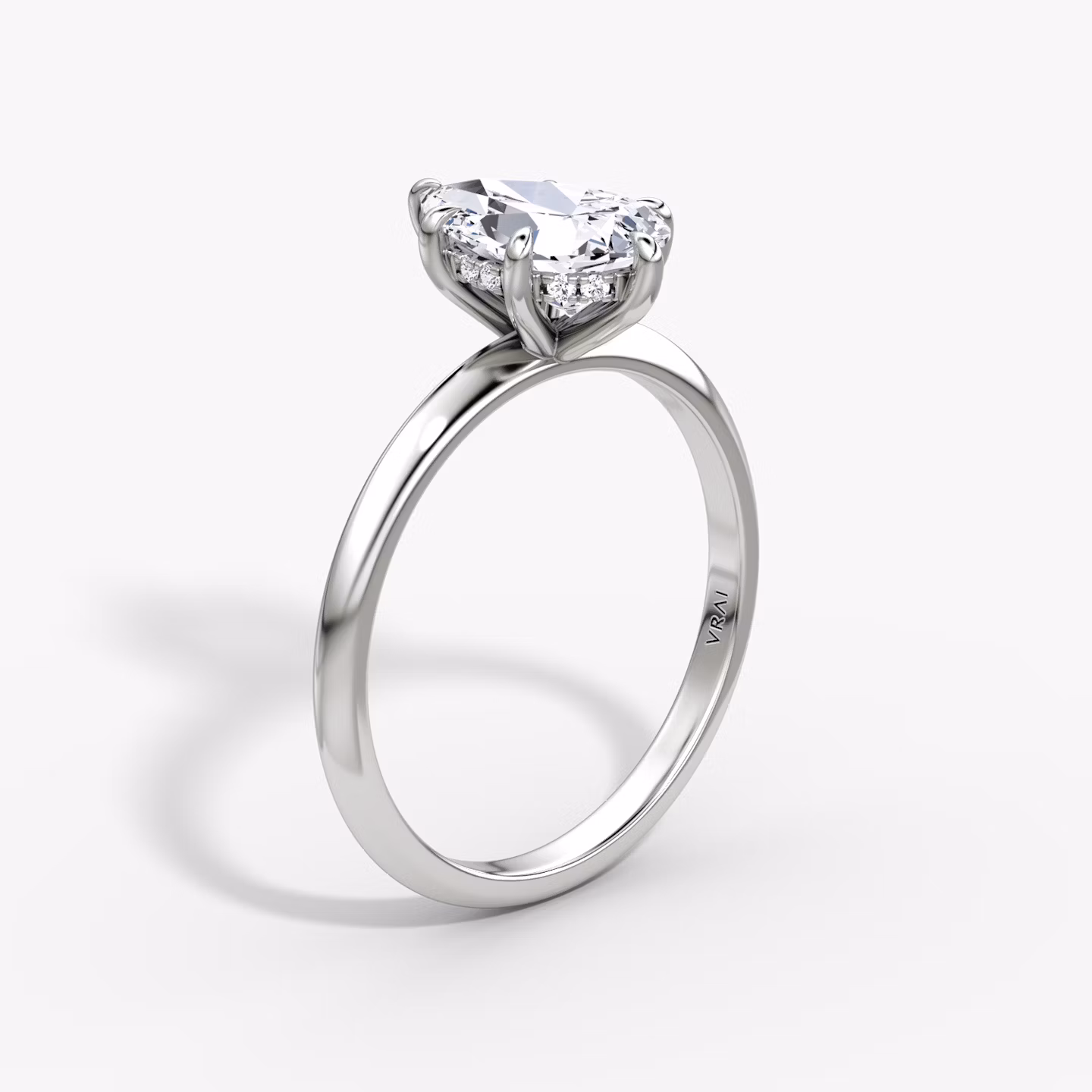 The Knife-Edge | Pear | Platinum | bandAccent: Plain | hiddenHalo: yes | diamondOrientation: vertical | caratWeight: other