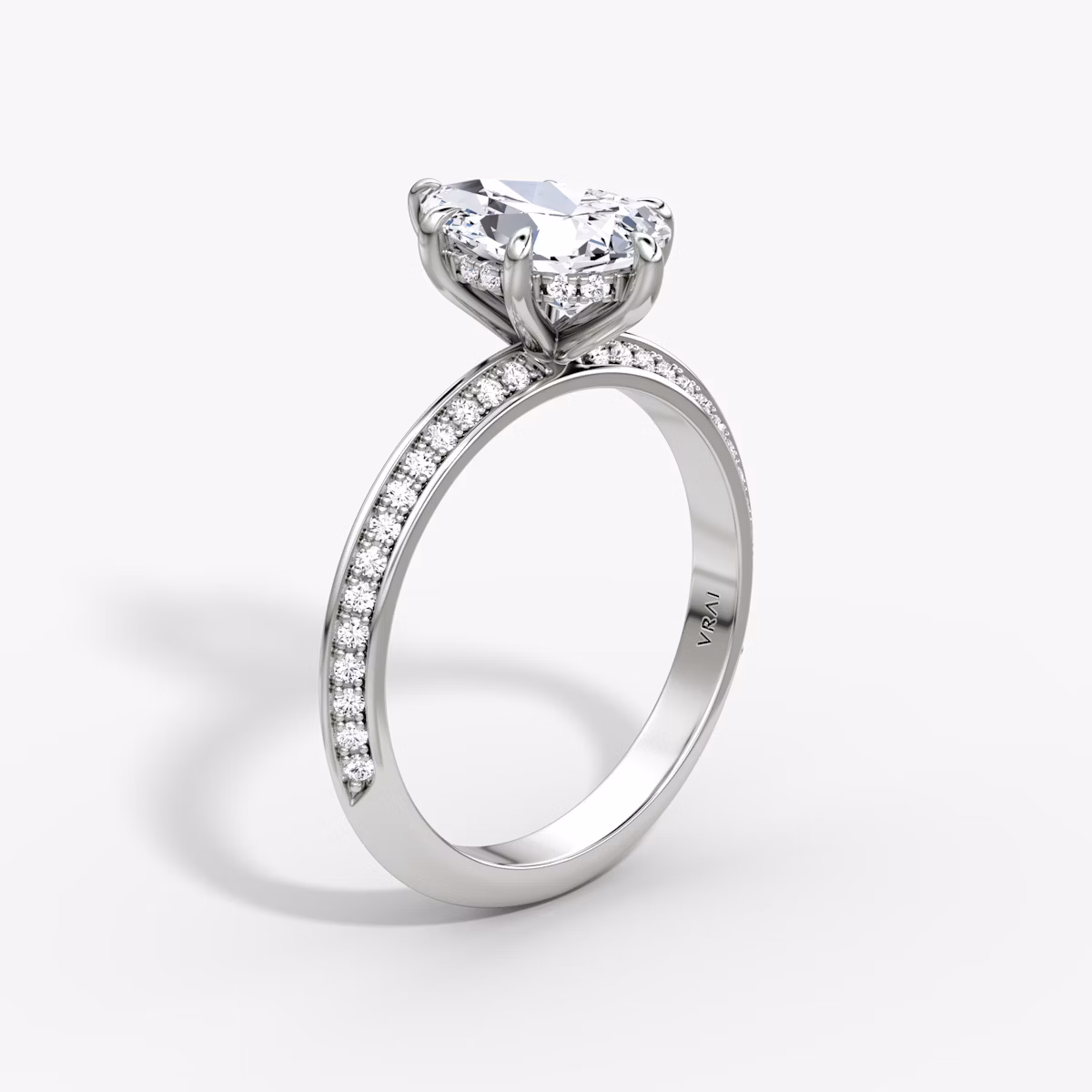The Knife-Edge | Pear | Platinum | bandAccent: Pavé | hiddenHalo: yes | diamondOrientation: vertical | caratWeight: other