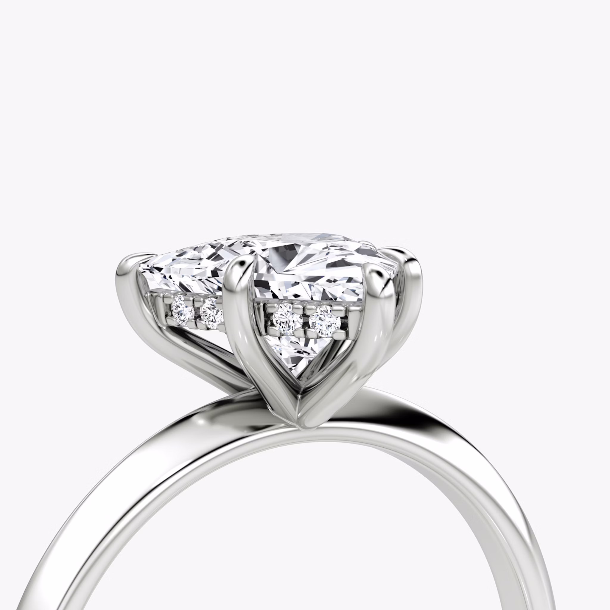 The Knife-Edge | Trillion | 18k | White Gold | bandAccent: Plain | hiddenHalo: yes | diamondOrientation: vertical | caratWeight: other