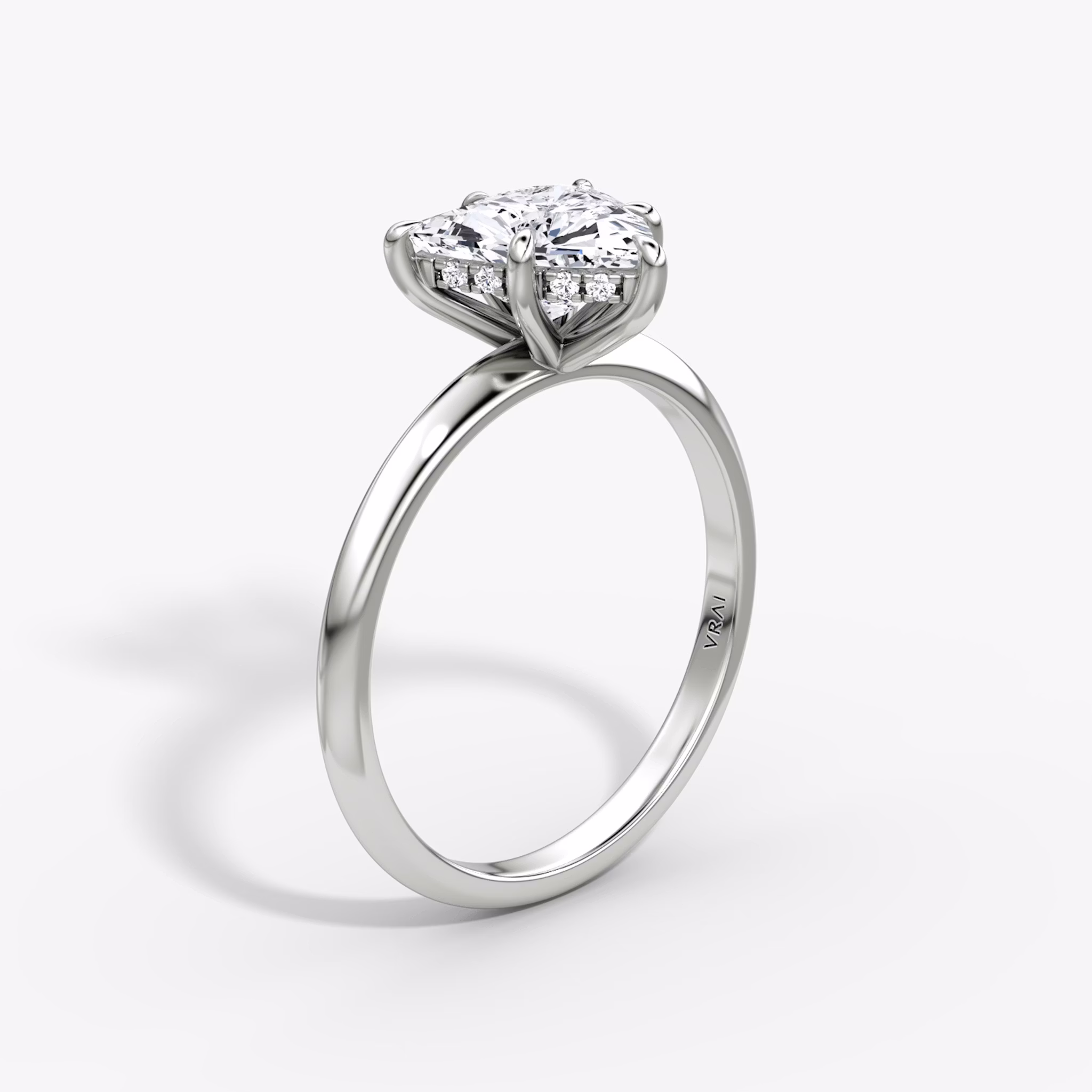 The Knife-Edge | Trillion | 18k | White Gold | bandAccent: Plain | hiddenHalo: yes | diamondOrientation: vertical | caratWeight: other