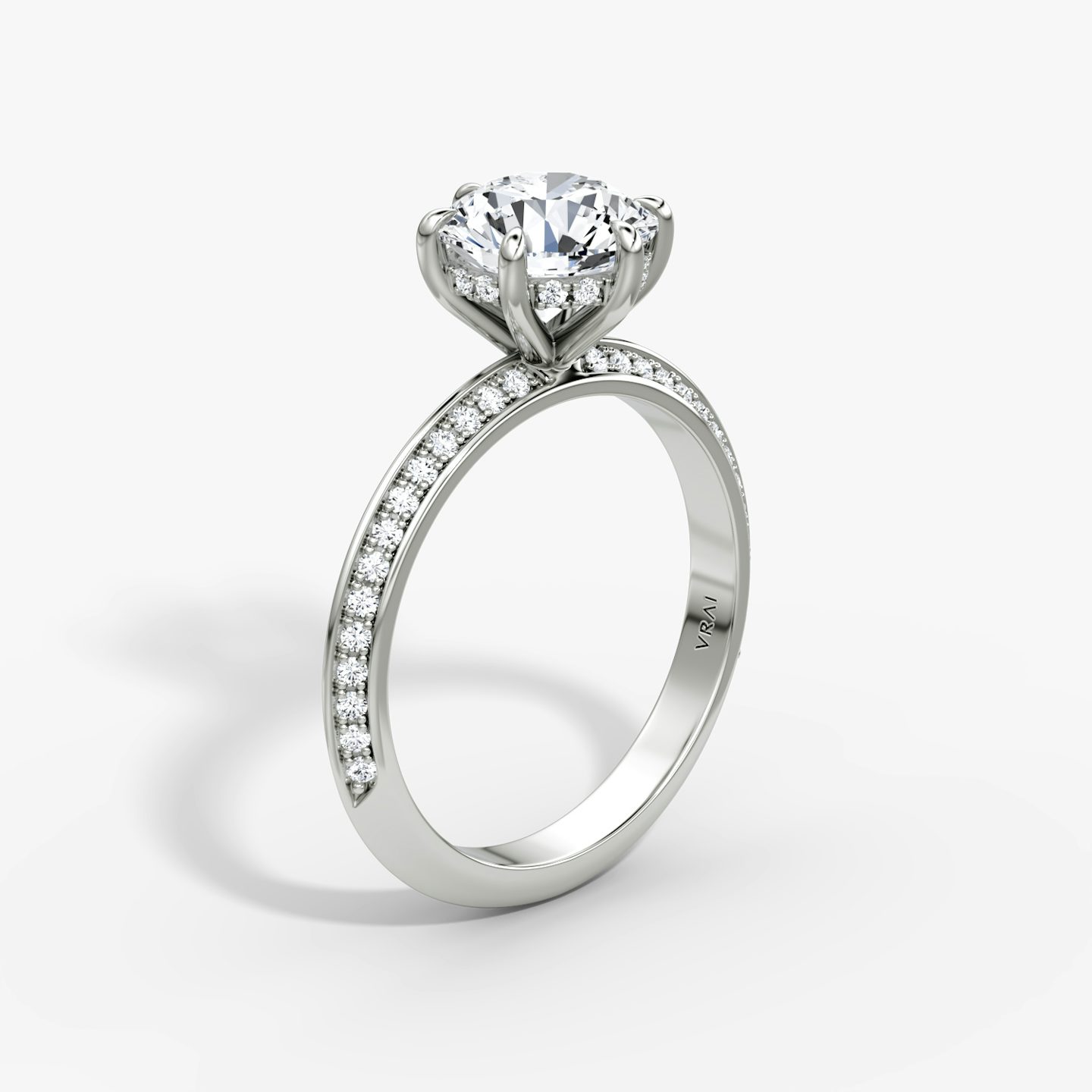 The Knife-Edge | Round Brilliant | Platinum | bandAccent: Pavé | caratWeight: 1.5ct | hiddenHalo: yes | diamondOrientation: vertical