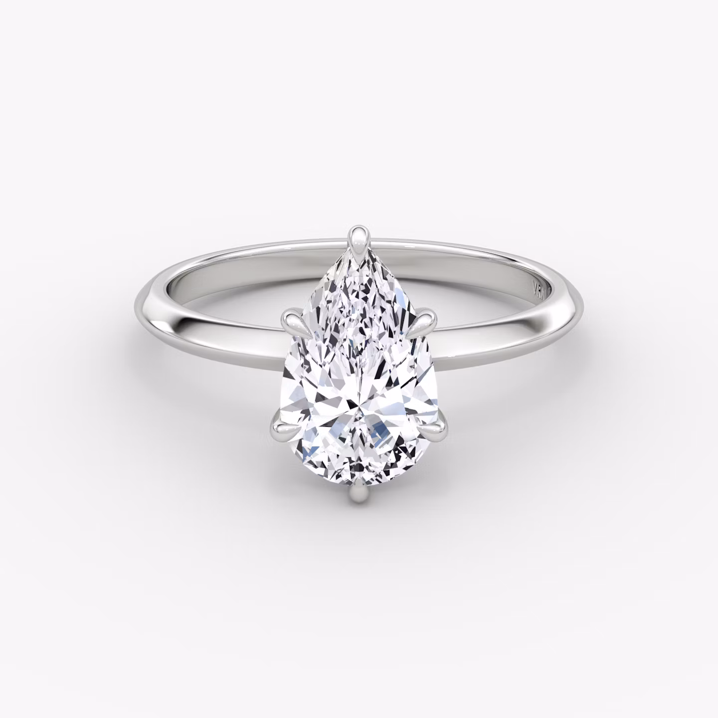 The Knife-Edge | Pear | Platinum | bandAccent: Plain | hiddenHalo: yes | diamondOrientation: vertical | caratWeight: other