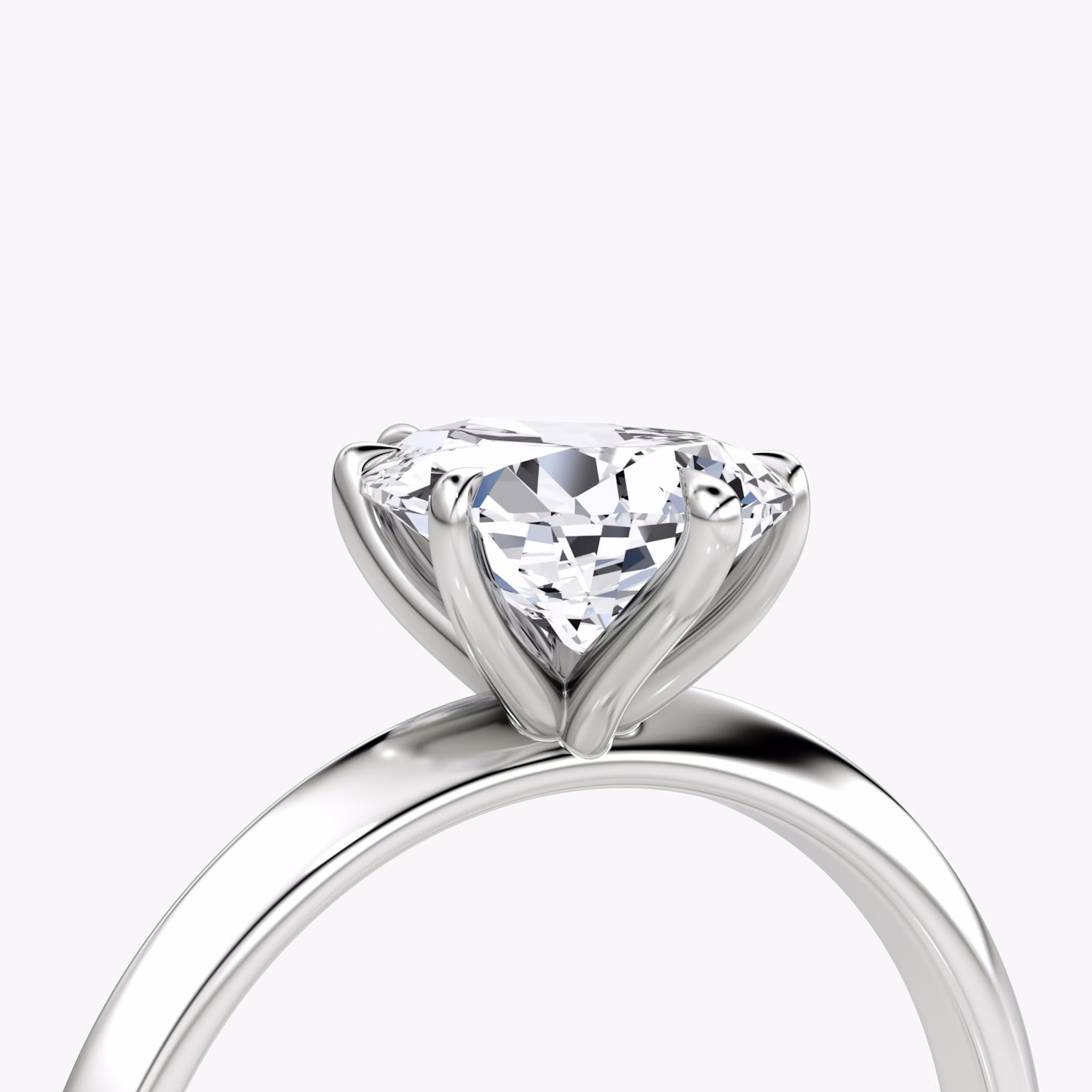 The Knife-Edge | Pear | Platinum | bandAccent: Plain | hiddenHalo: no | diamondOrientation: vertical | caratWeight: other