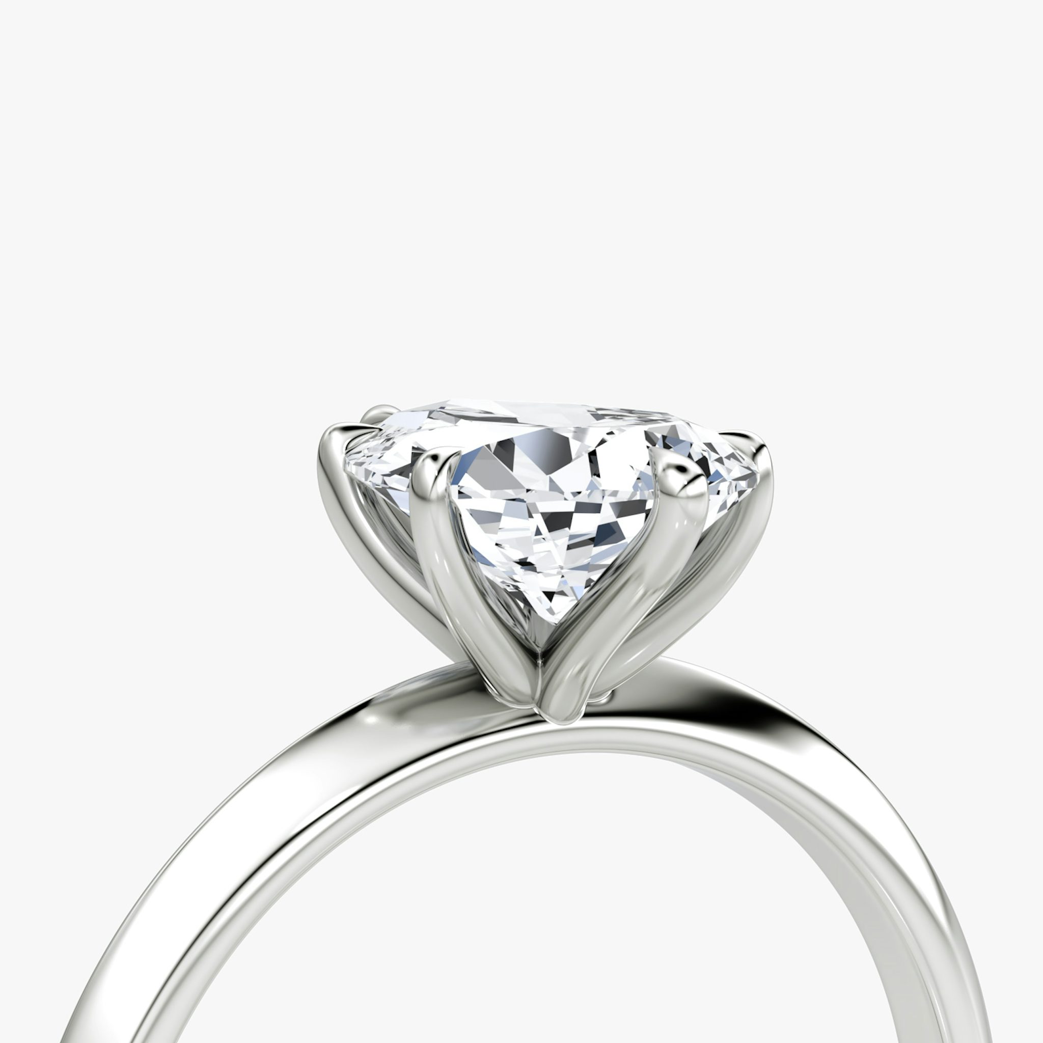 The Knife-Edge | Pear | Platinum | bandAccent: Plain | hiddenHalo: no | diamondOrientation: vertical | caratWeight: other