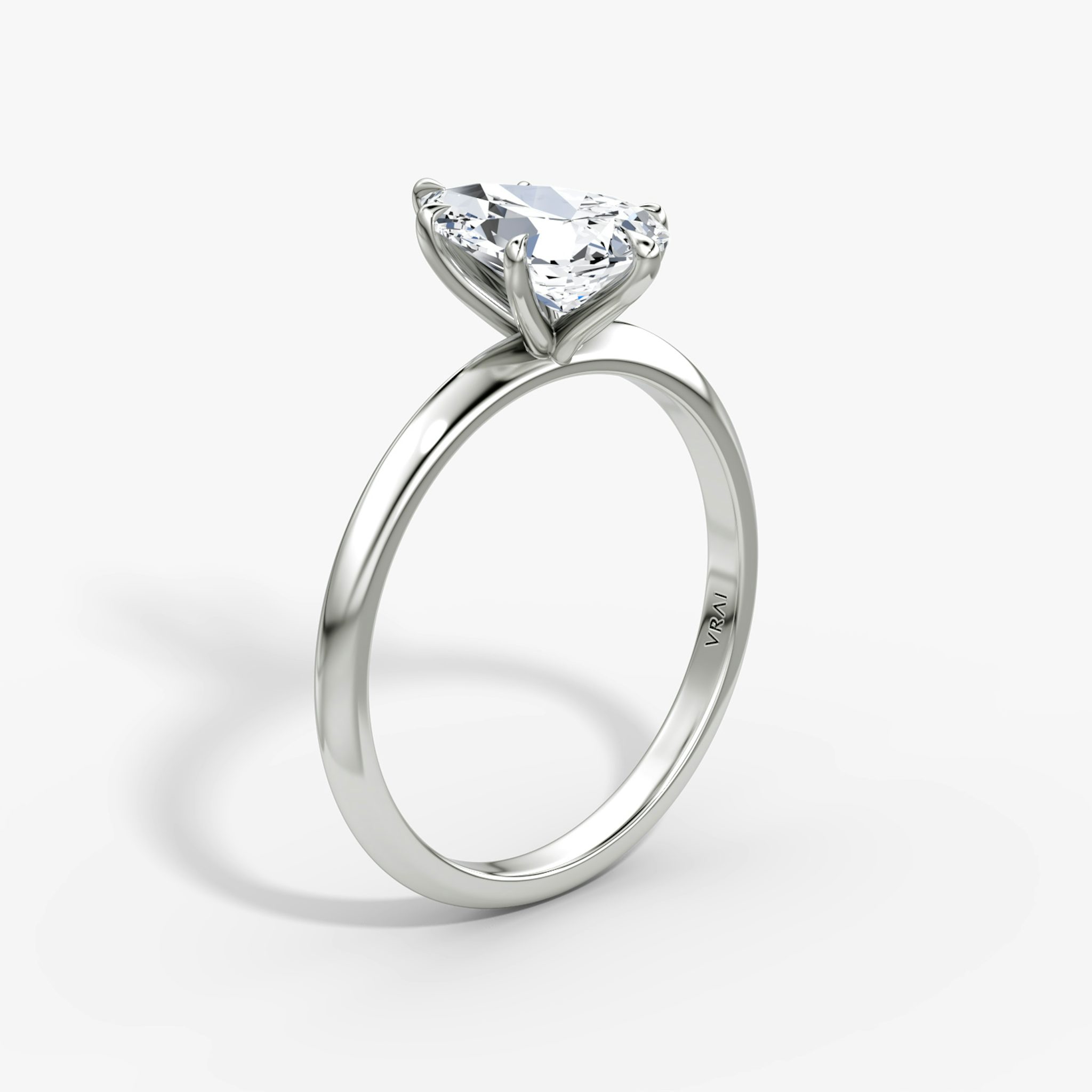 The Knife-Edge | Pear | Platinum | bandAccent: Plain | hiddenHalo: no | diamondOrientation: vertical | caratWeight: other