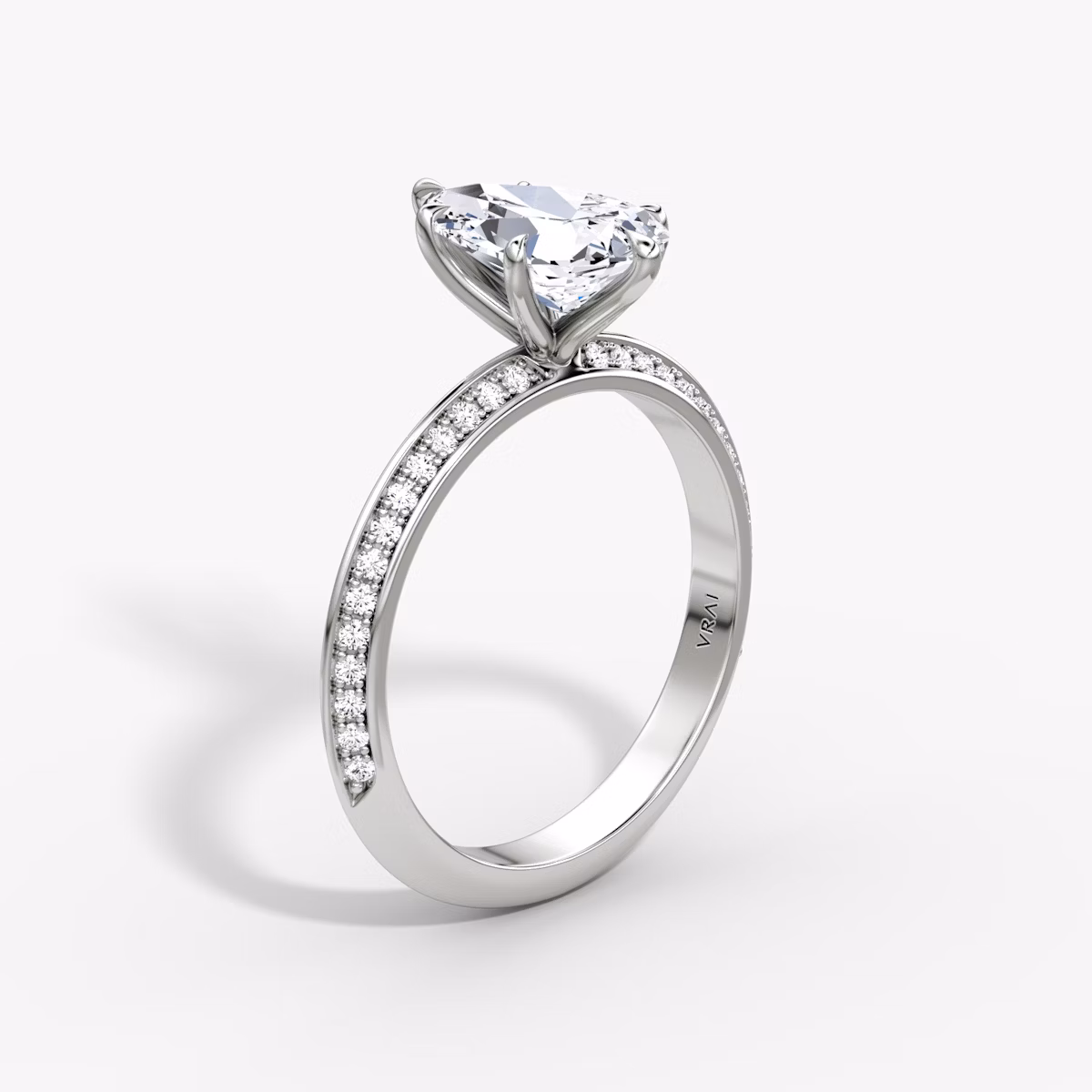 The Knife-Edge | Pear | Platinum | bandAccent: Pavé | hiddenHalo: no | diamondOrientation: vertical | caratWeight: other