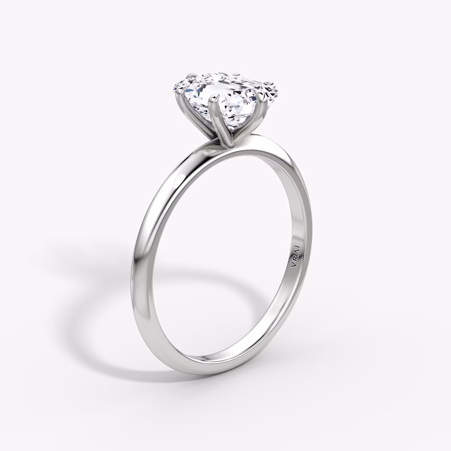 The Knife-Edge | Emerald | Platinum | bandAccent: Plain | hiddenHalo: no | diamondOrientation: vertical | caratWeight: other