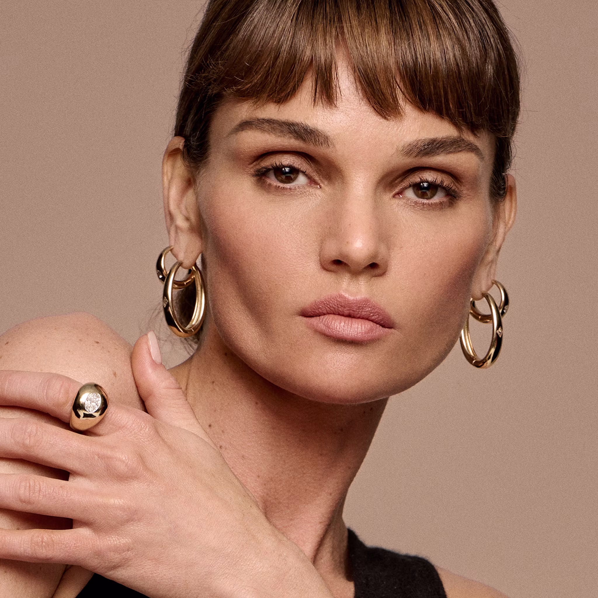 Inner earring is Oval Dome Hoop