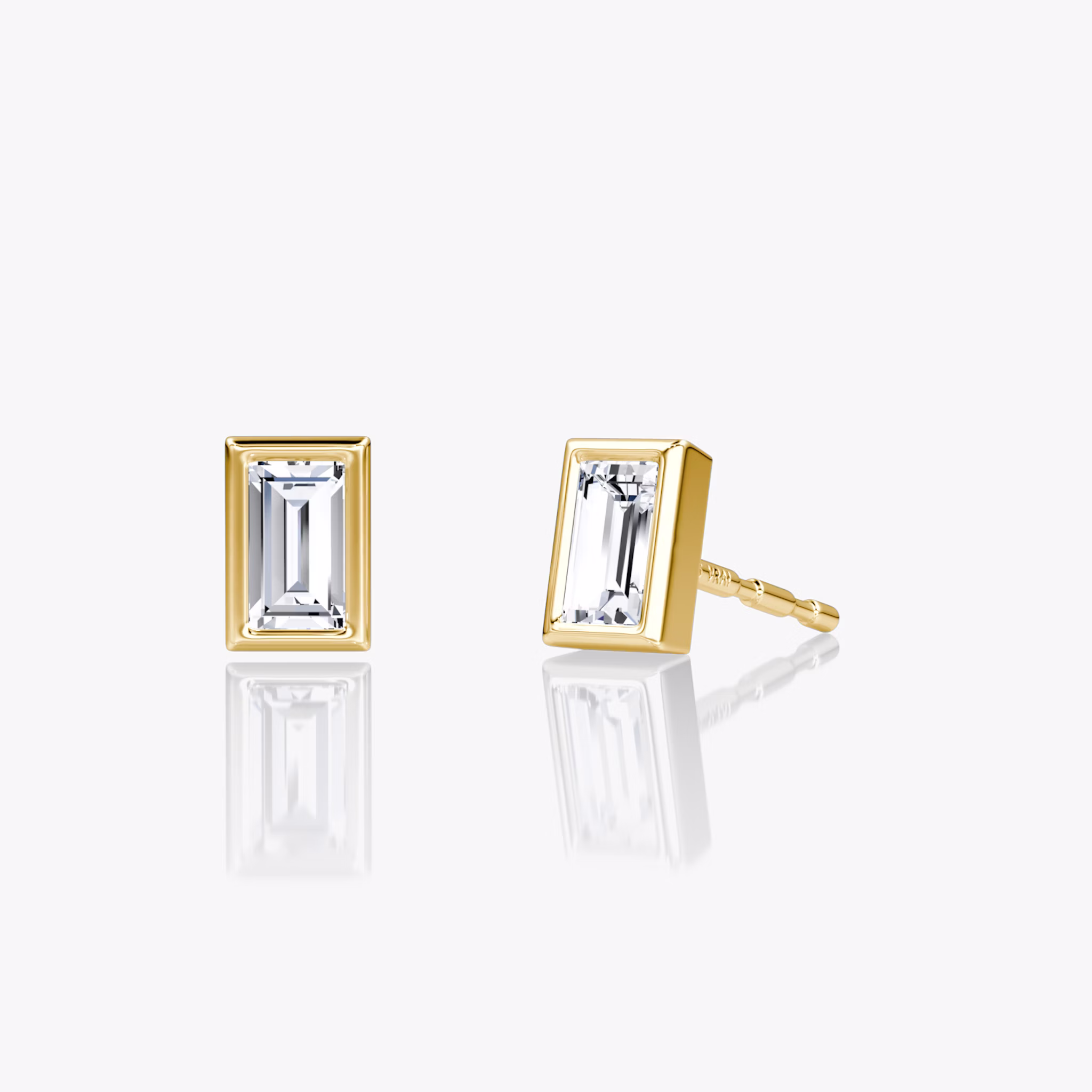 A pair of Knife-Edge Baguette Semi-Bezel Studs.