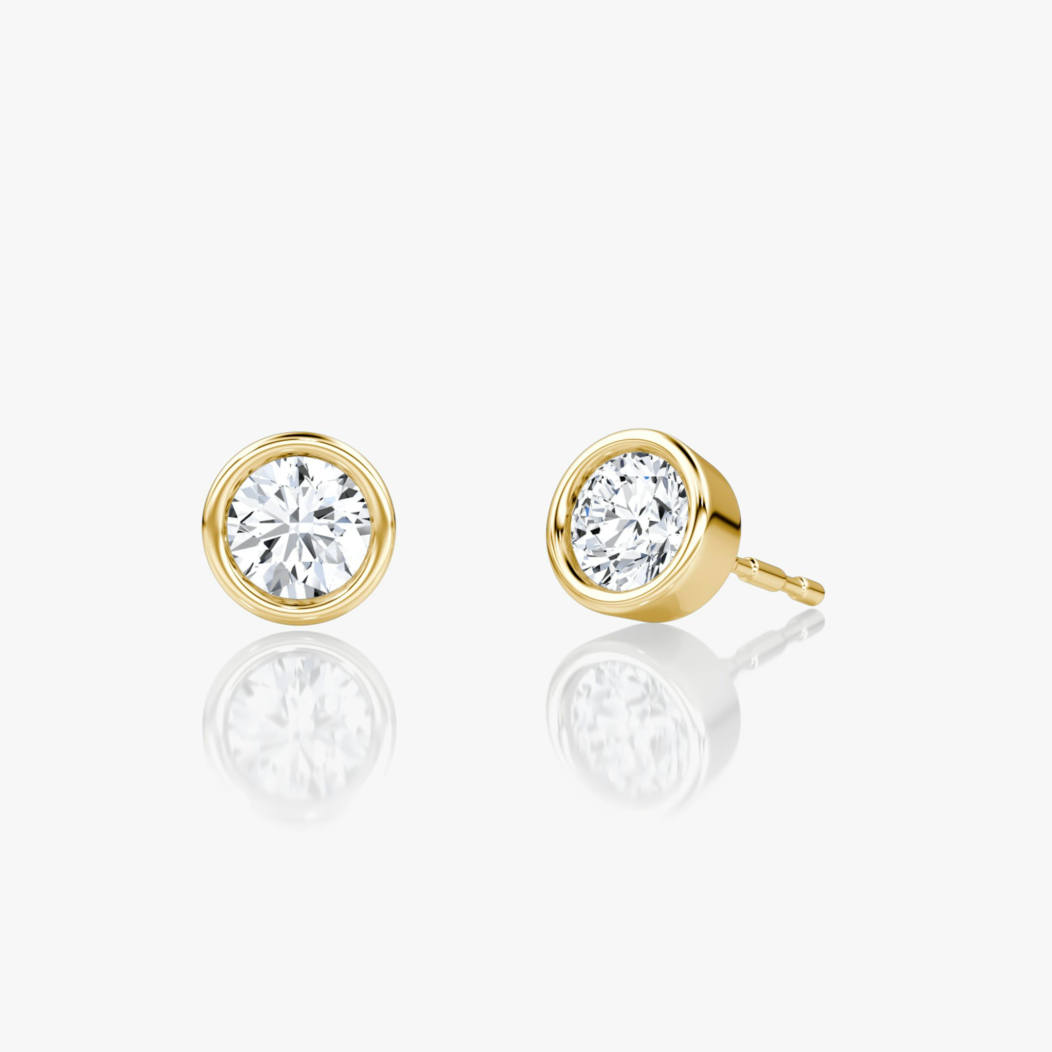 0.25ct round bezel-set solitaire stud earring in yellow gold, shown close-up for fine jewelry detail.