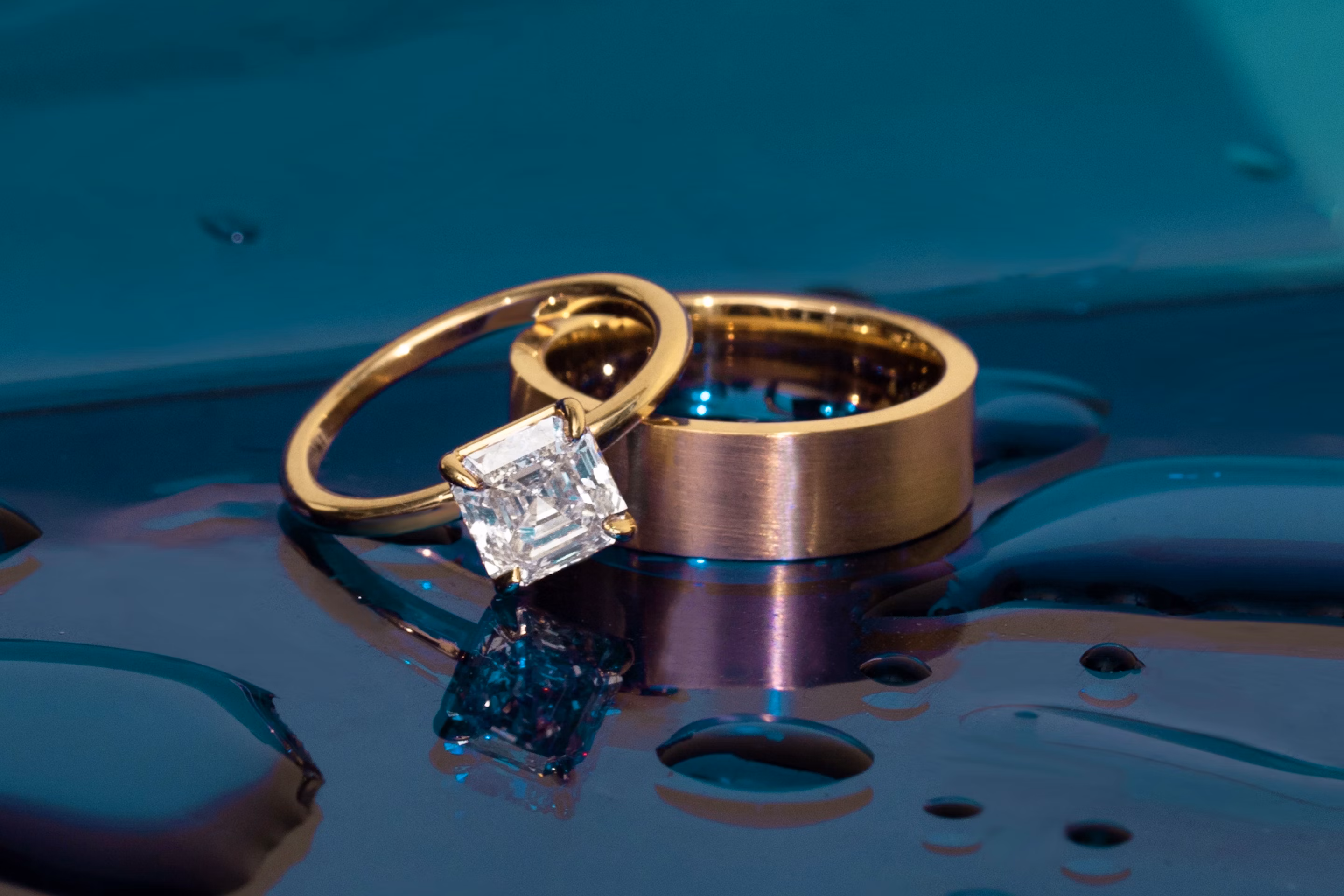 solitaire engagement ring with a square cut diamond and a thick band with no diamond