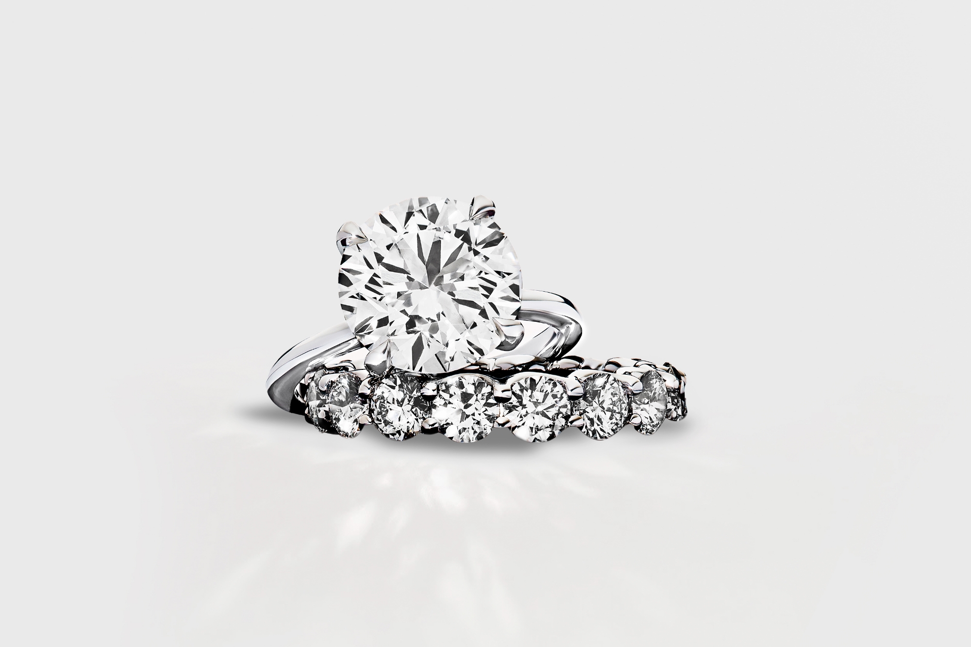 engagement ring in platinum with a pave wedding band