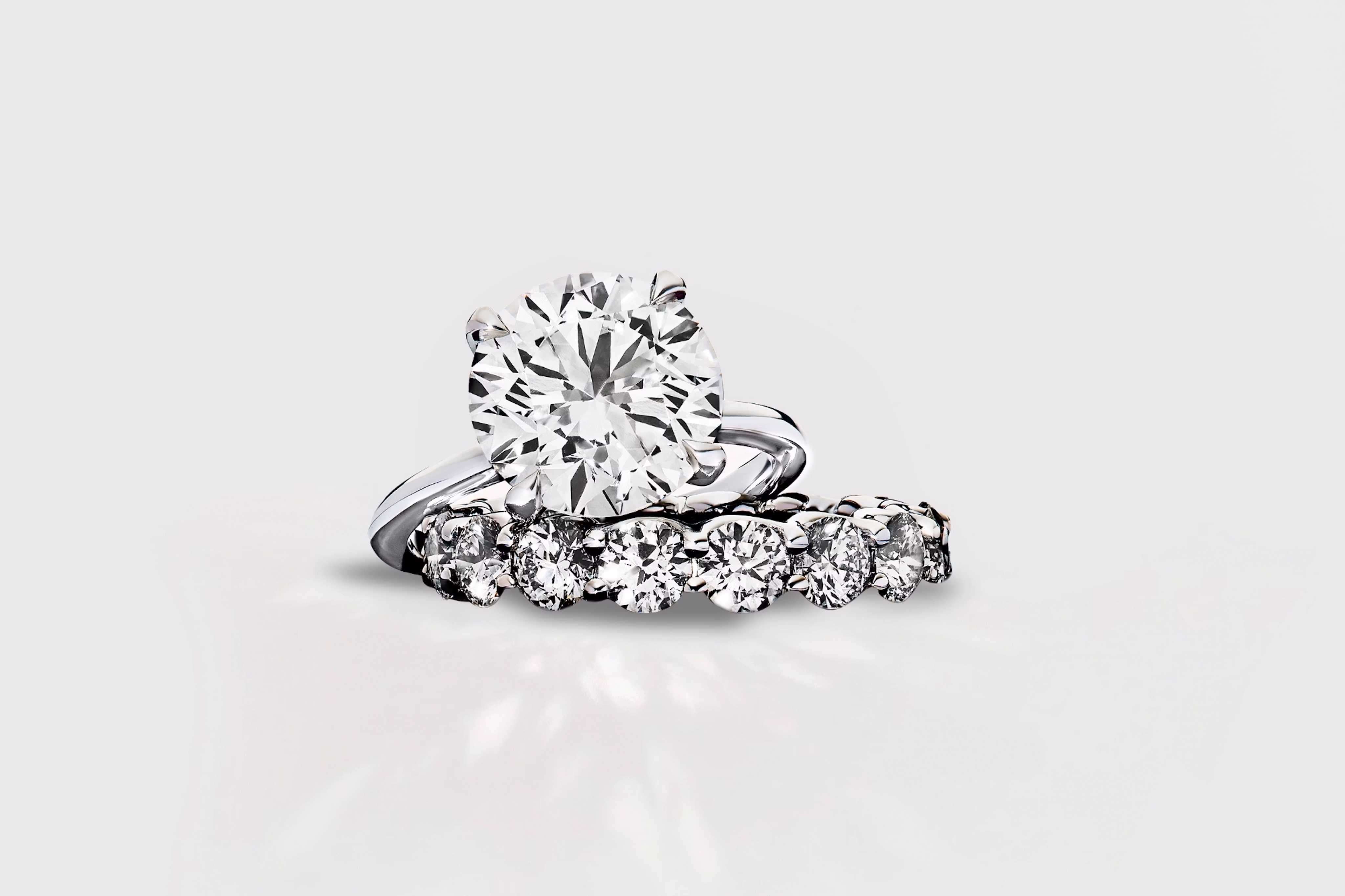 engagement ring in platinum with a pave wedding band
