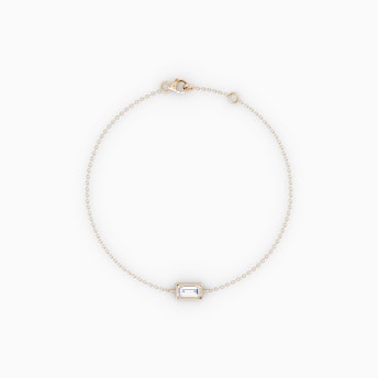 The Bezel Solitaire Bracelet in yellow gold.