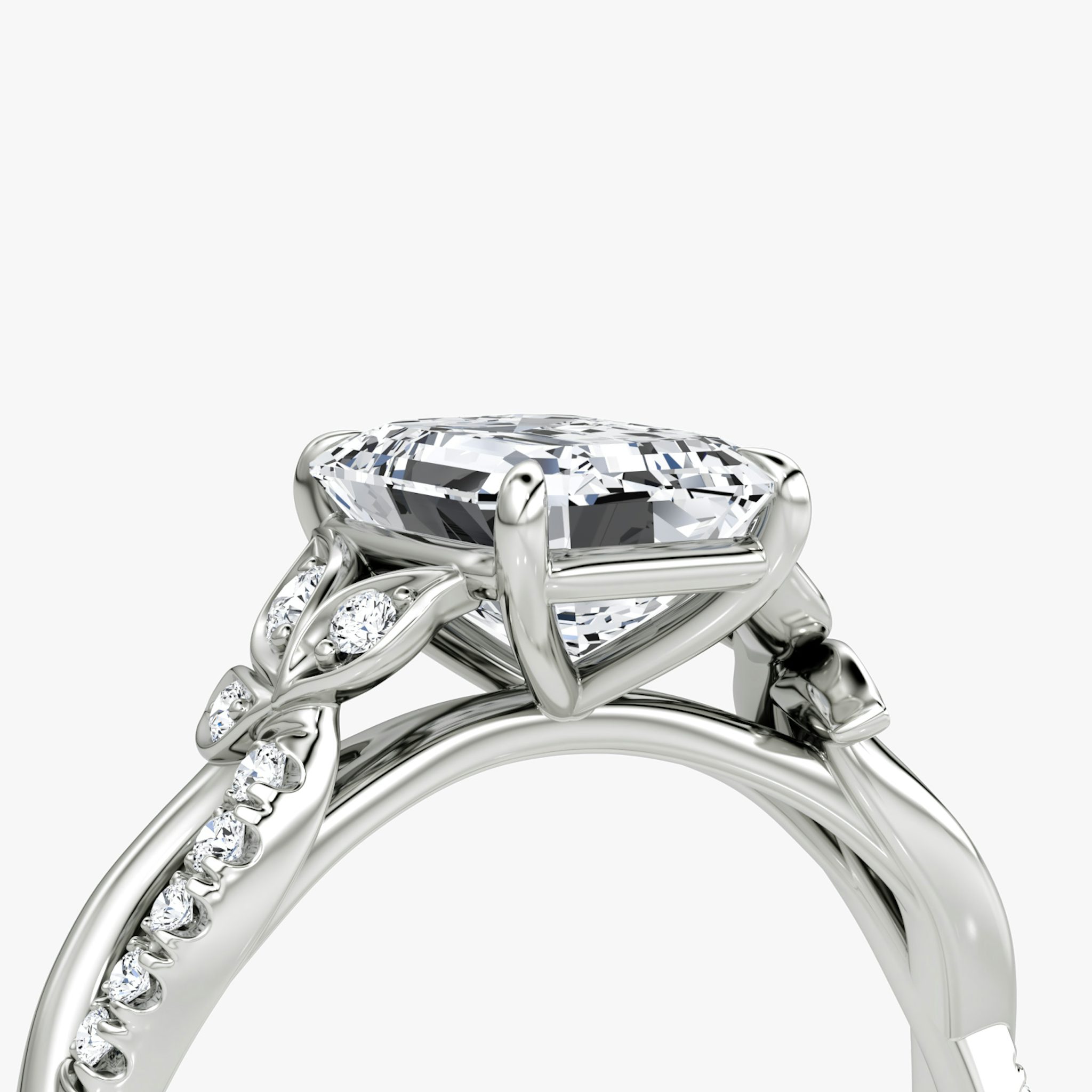 The Twisted Floral | Emerald | Platinum | bandAccent: Pavé | diamondOrientation: vertical | caratWeight: other