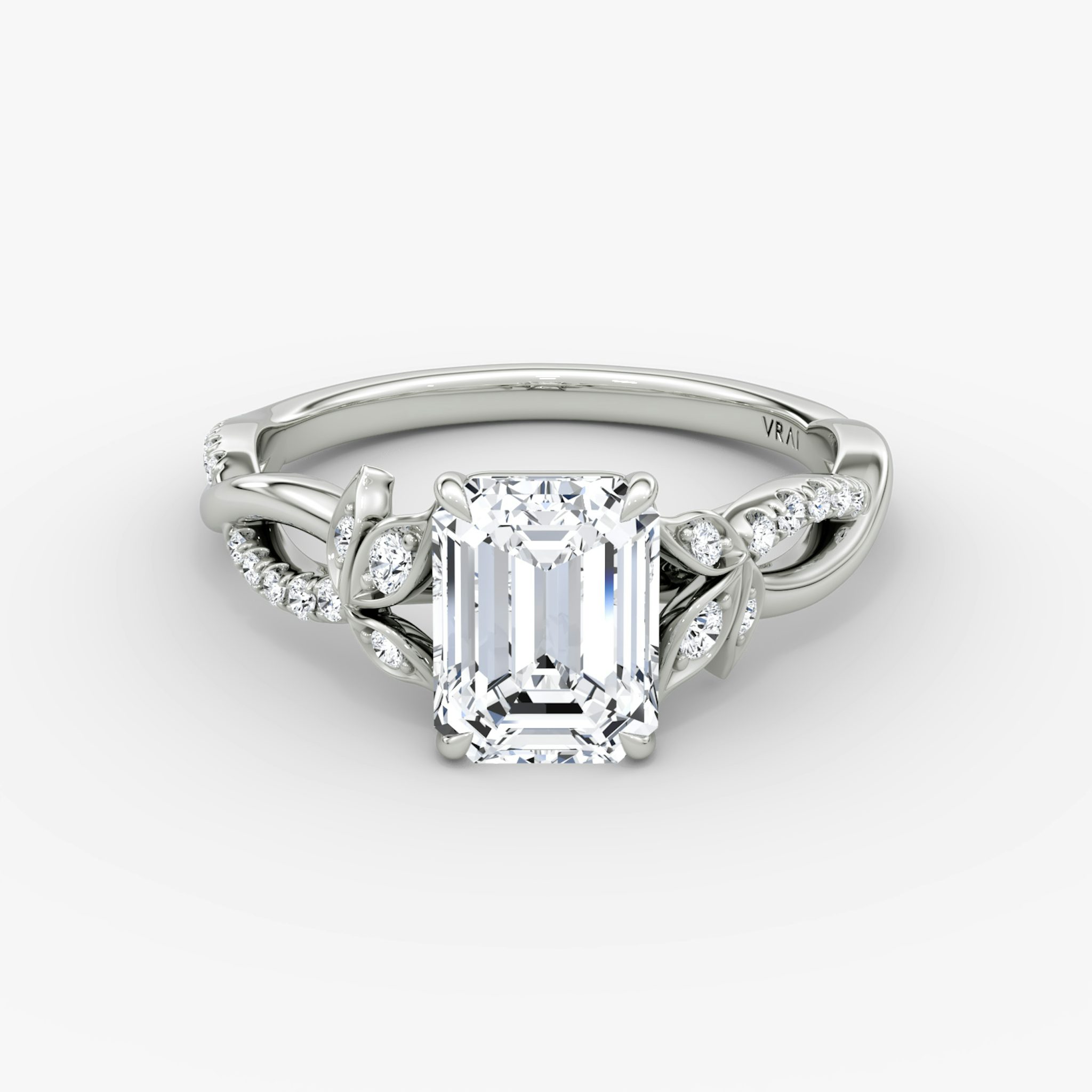 The Twisted Floral | Emerald | Platinum | bandAccent: Pavé | diamondOrientation: vertical | caratWeight: other