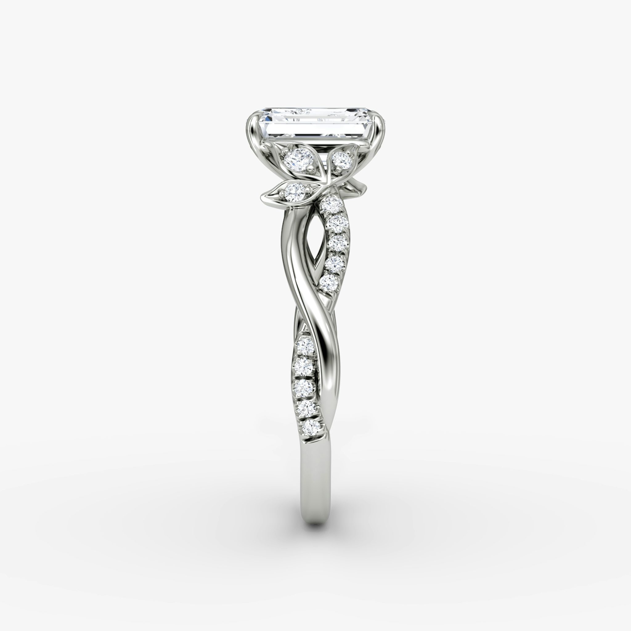 The Twisted Floral | Emerald | Platinum | bandAccent: Pavé | diamondOrientation: vertical | caratWeight: other