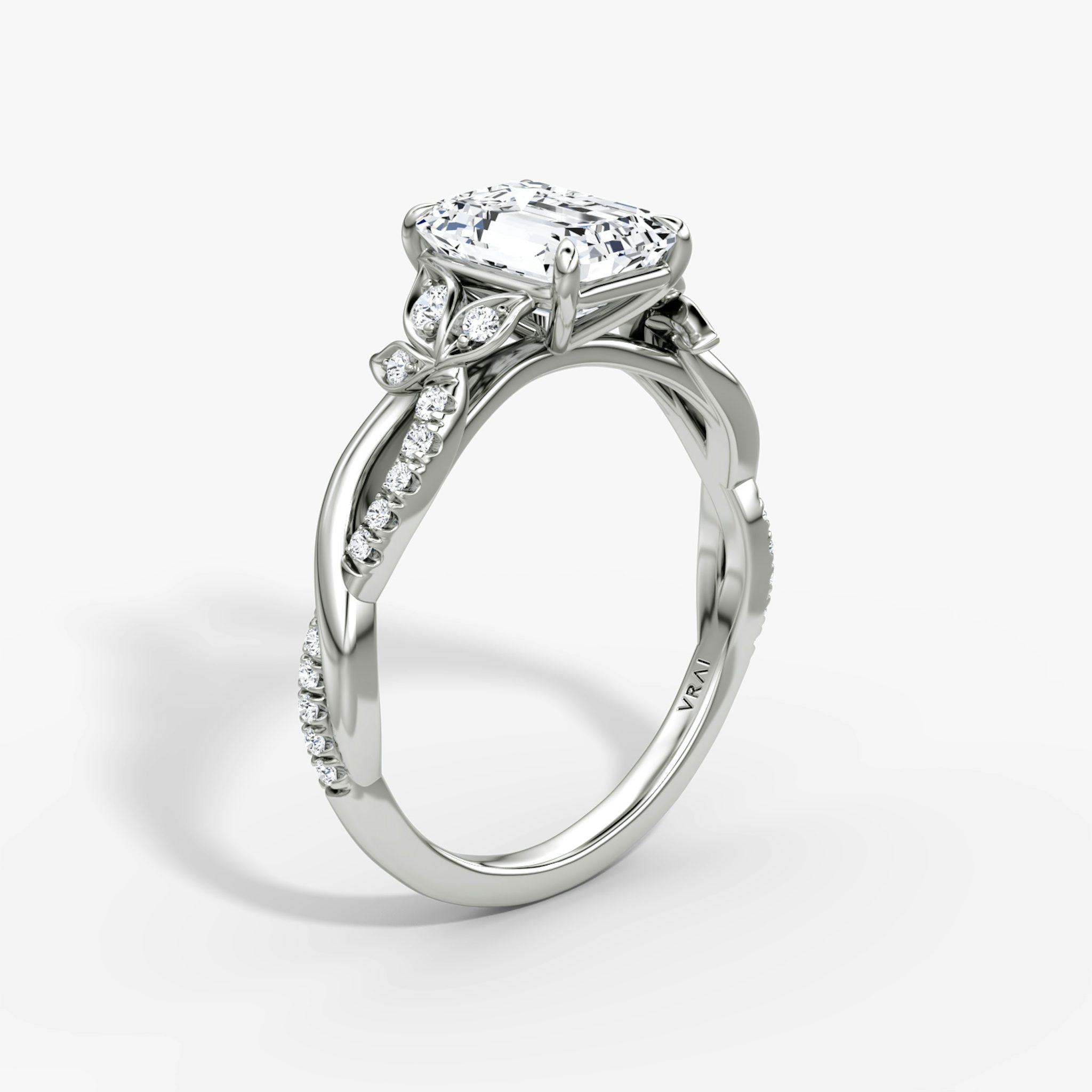 The Twisted Floral | Emerald | Platinum | bandAccent: Pavé | diamondOrientation: vertical | caratWeight: other
