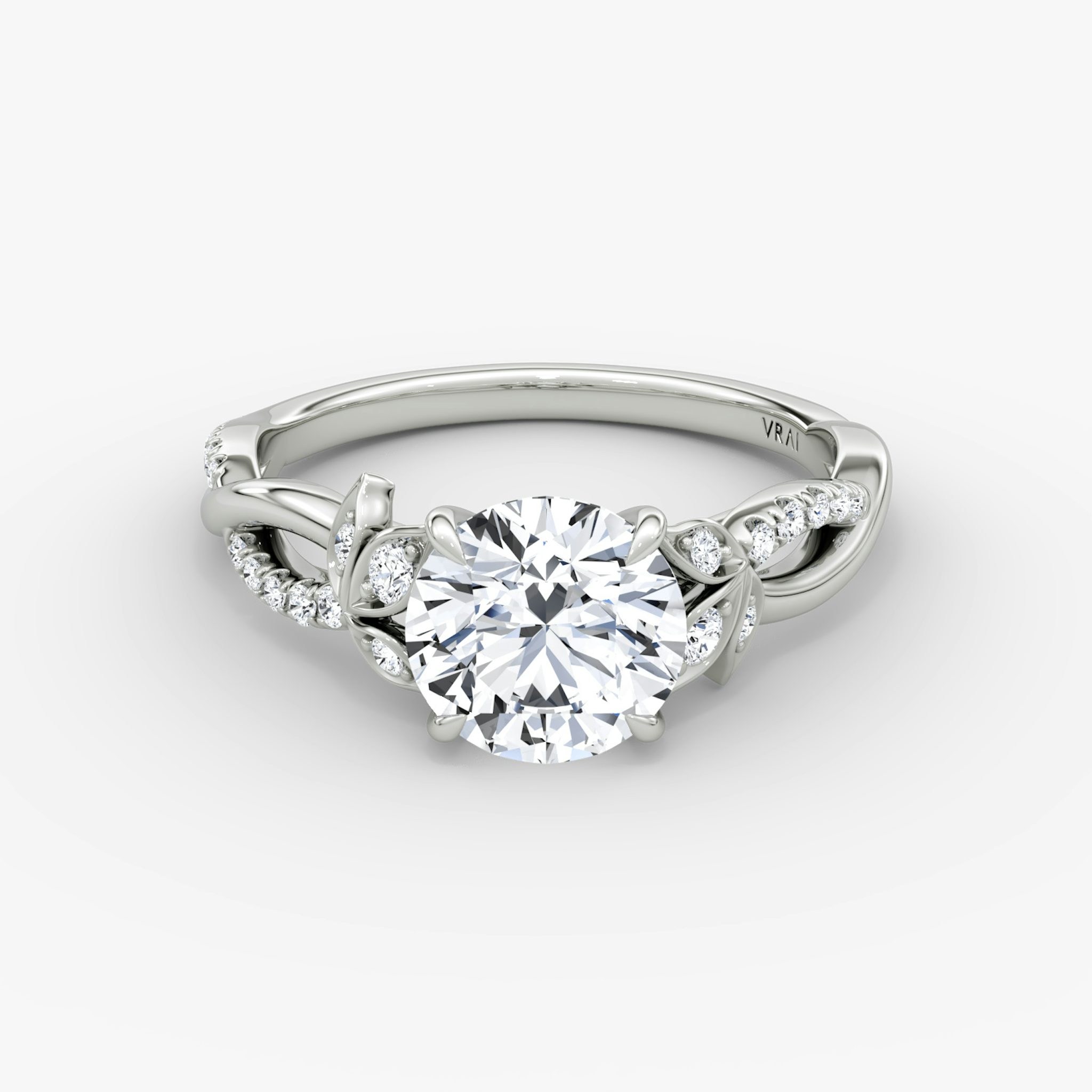 The Twisted Floral | Round Brilliant | Platinum | bandAccent: Pavé | caratWeight: 1.0ct | diamondOrientation: vertical
