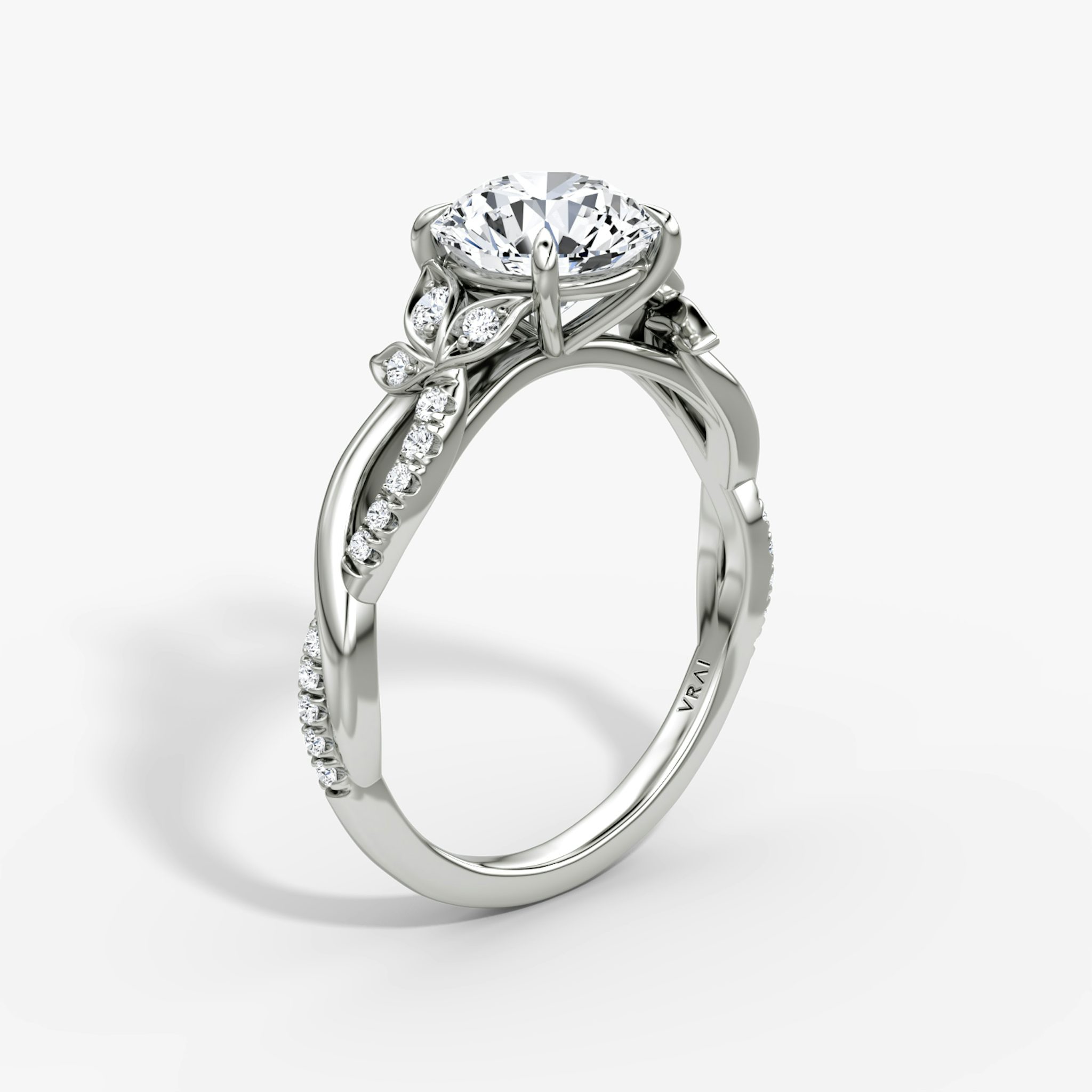 The Twisted Floral | Round Brilliant | Platinum | bandAccent: Pavé | caratWeight: 1.0ct | diamondOrientation: vertical