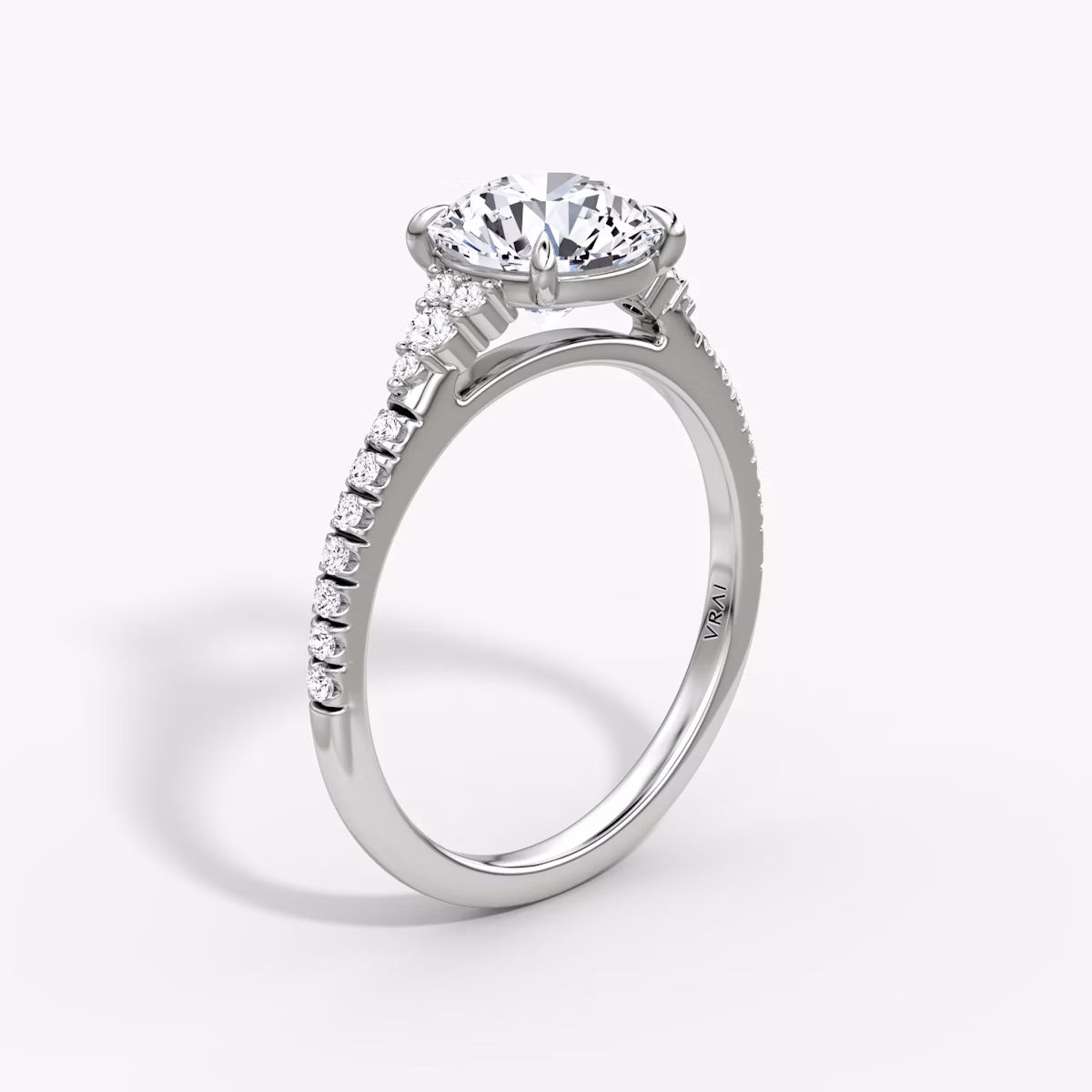 The Side Cluster Cathedral | Round Brilliant | Platinum | bandAccent: Pavé | caratWeight: other | diamondOrientation: vertical