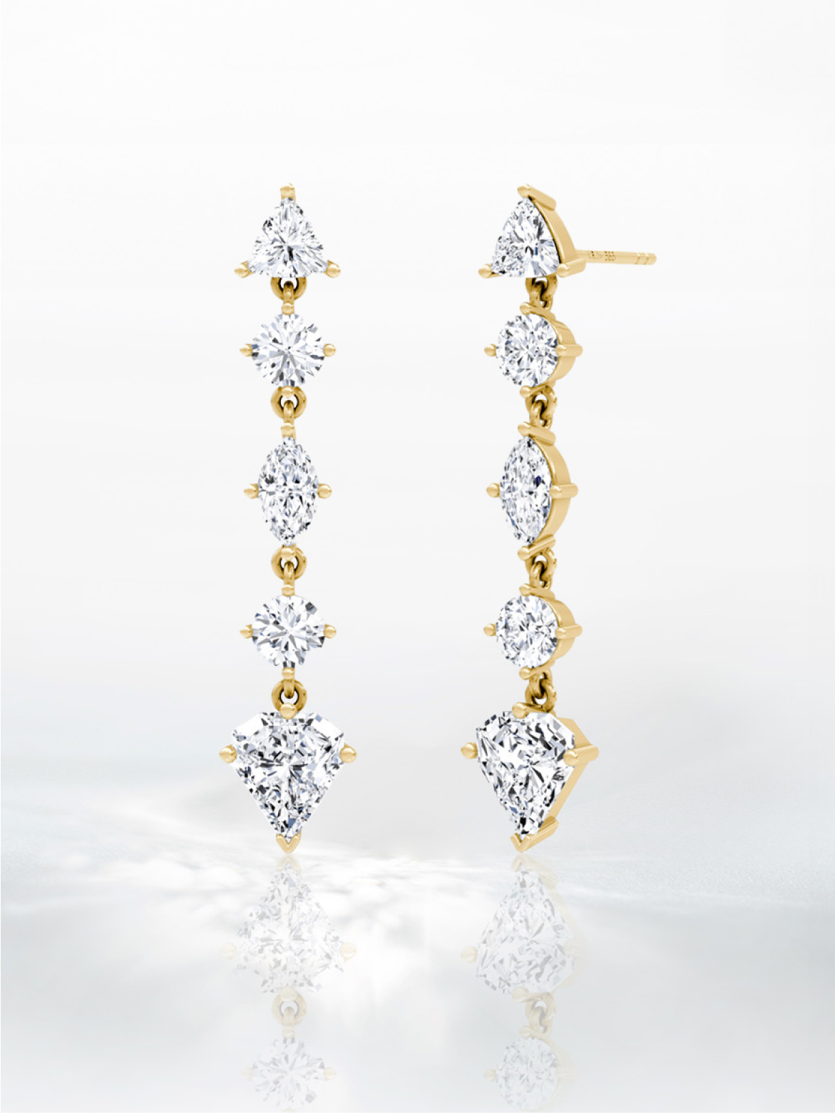 Two dangly gold earrings with 5 diamonds each.