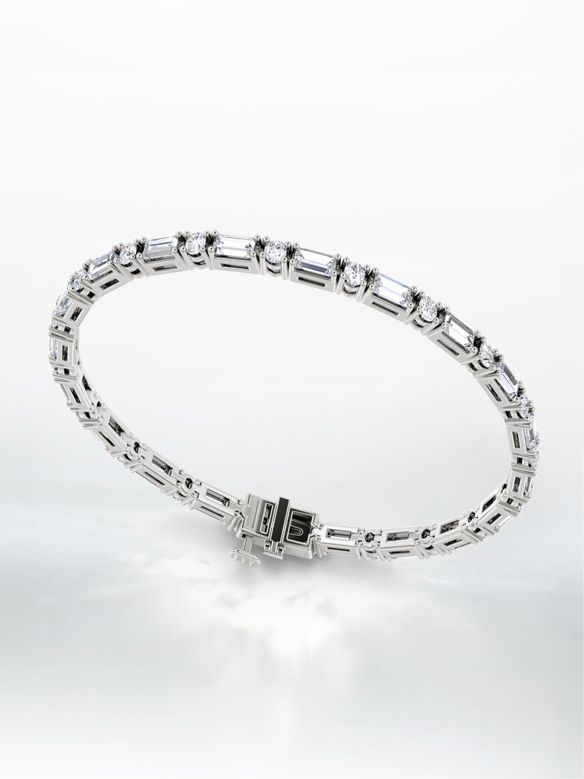A silver, mixed shape tennis bracelet.