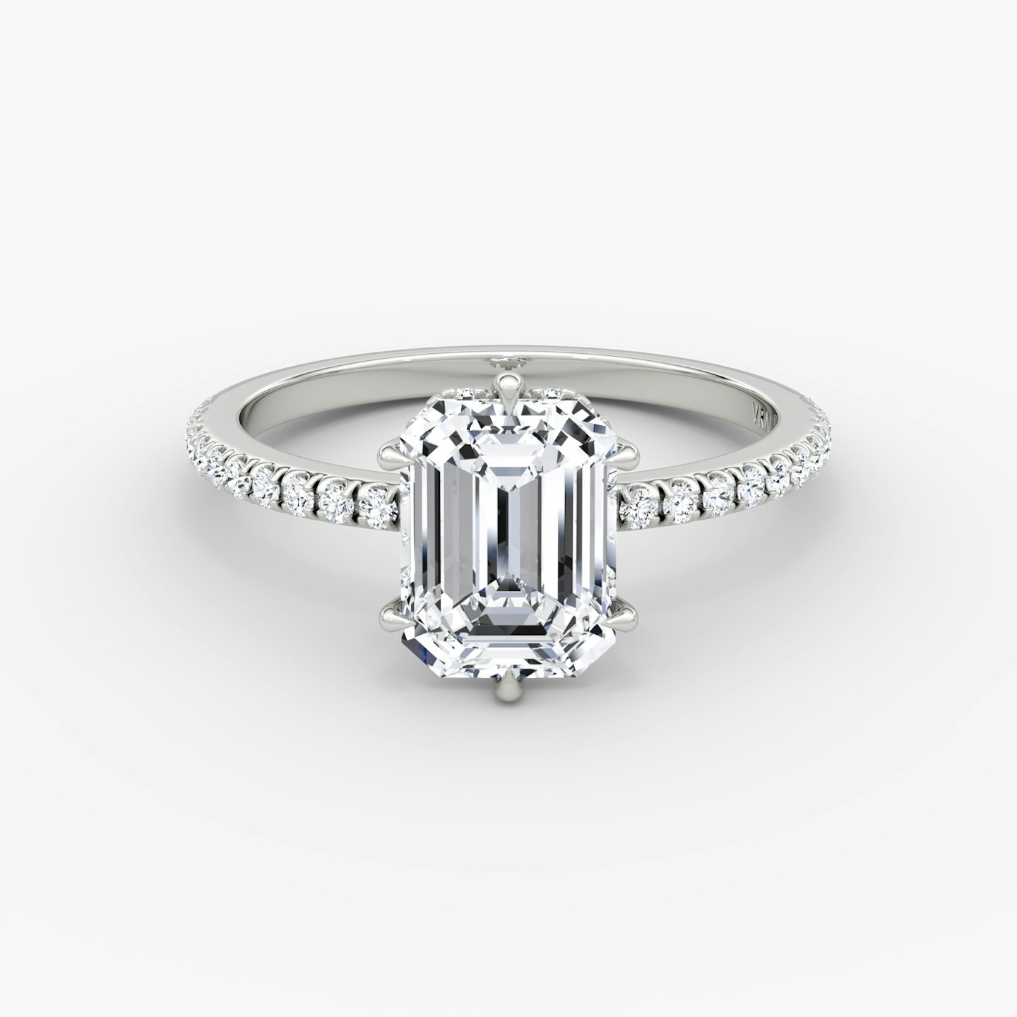 The Signature 6 Prong | Emerald | 18k | White Gold | bandAccent: Pavé | bandWidth: standard | hiddenHalo: yes | diamondOrientation: vertical | caratWeight: other